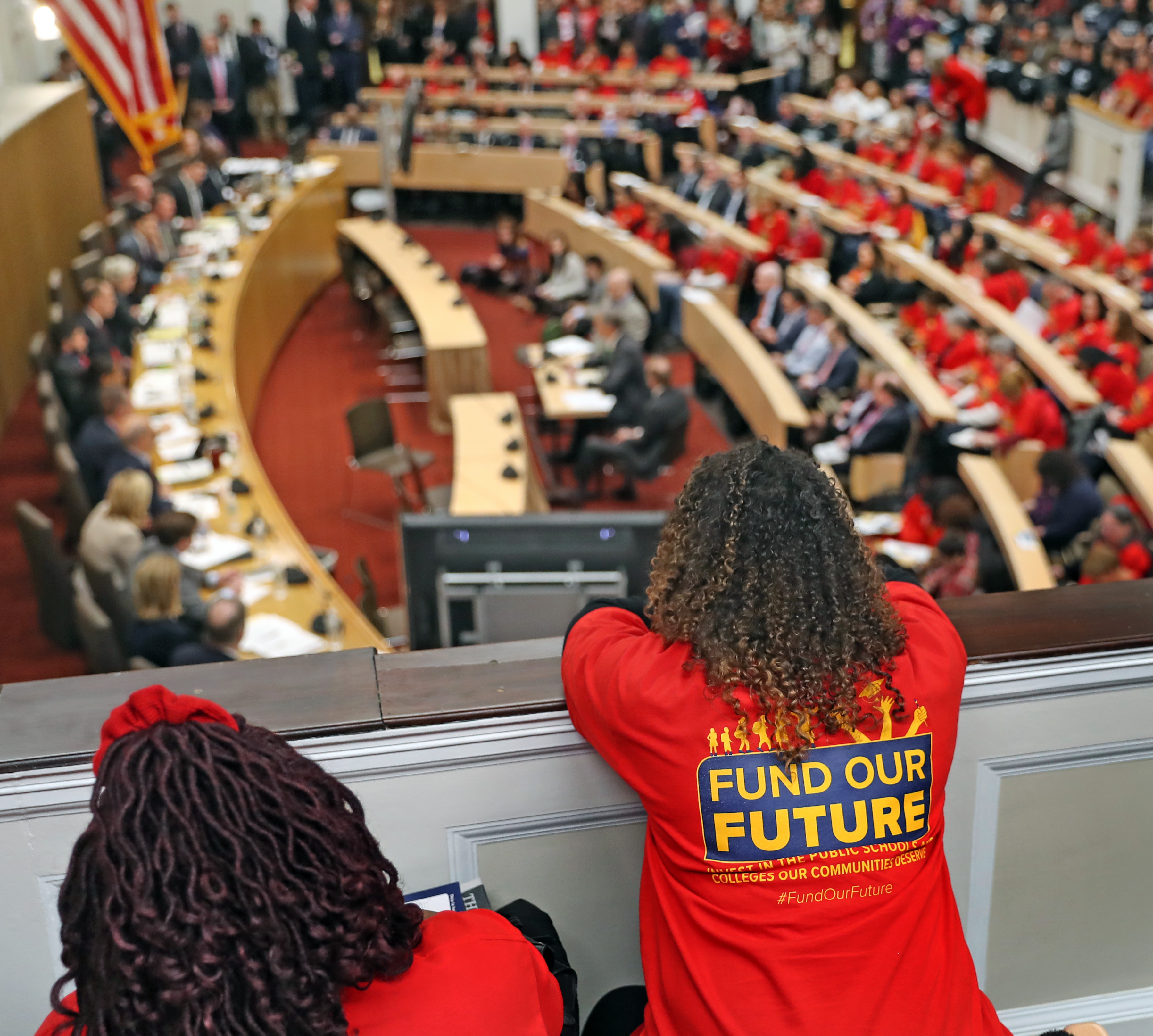 Angelica DaSilva of Dorchester (right) attended a packed education hearing at the State House’s Gardner Auditorium.