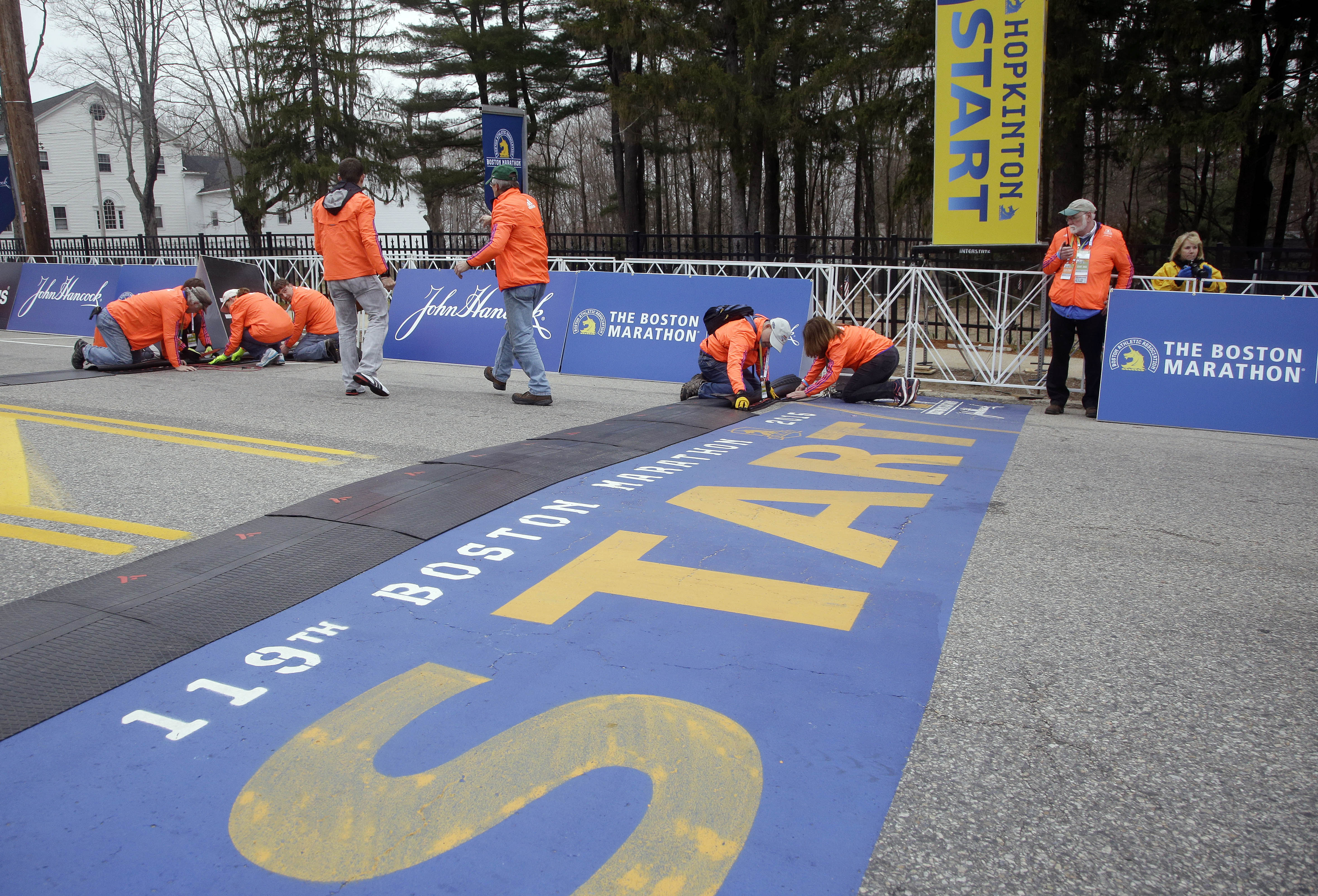 Race officials set up electronics at the starting line.