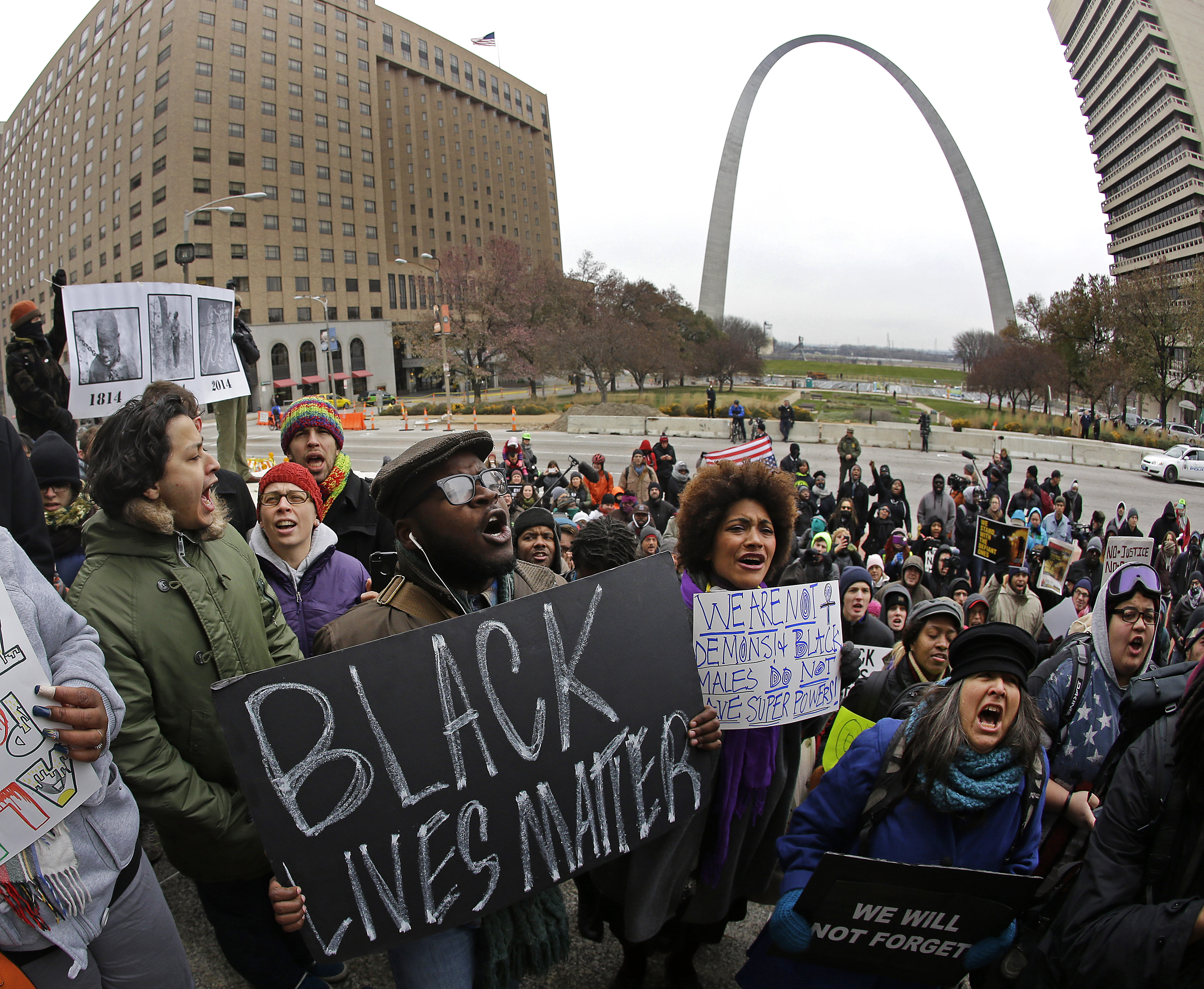 Protesters demonstrated on the steps of the Old Courthouse in downtown St. Louis against a grand jury’s decision not to indict a white Ferguson police officer who fatally shot an unarmed black teen.