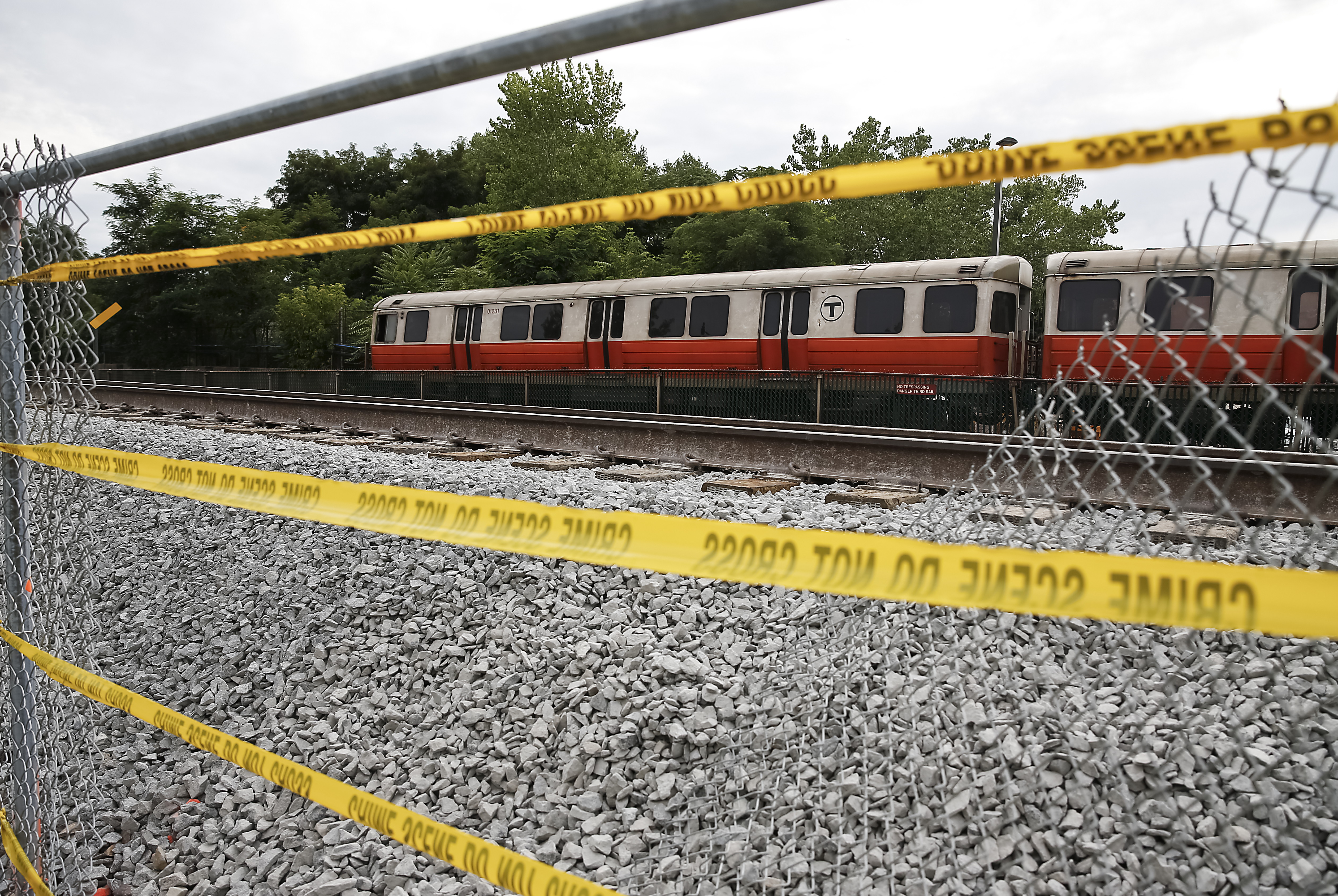 A hole was cut in the fence so passengers could leave the track right of way.