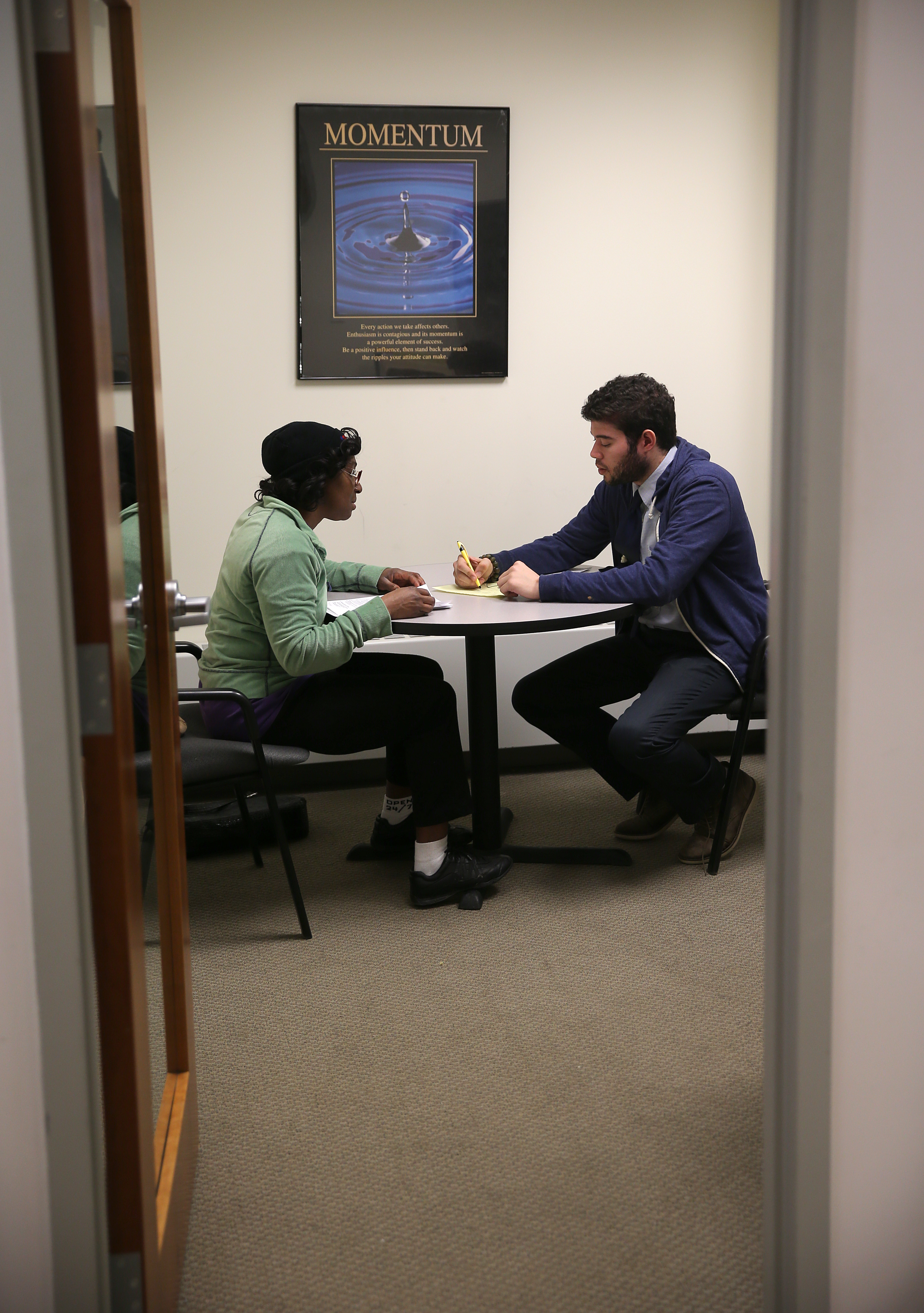 Suzanne Lynch (left) of Boston received advice from Jason Andrade, who is a financial coach.