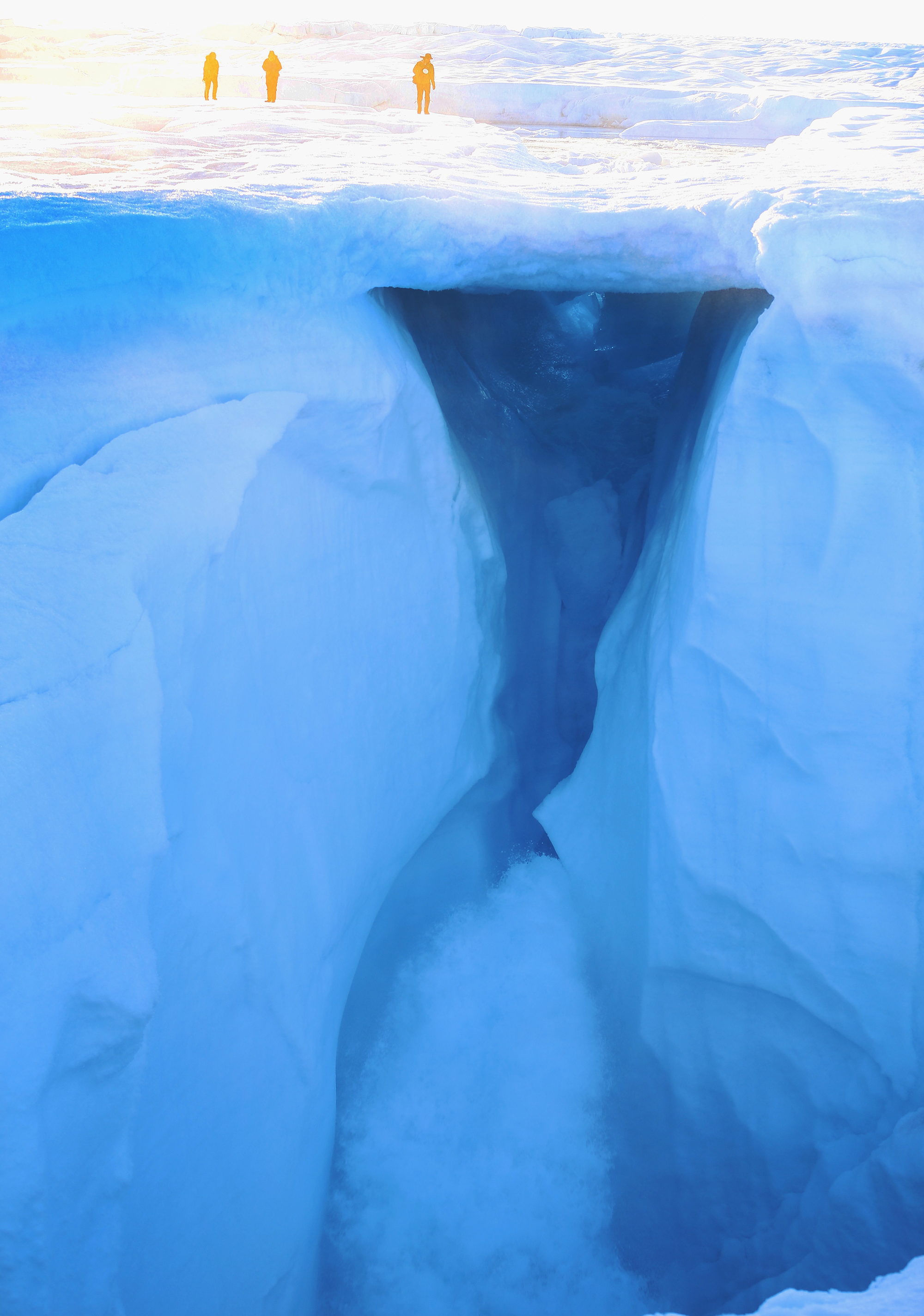Obervers stood in 2013 above melting water on part of the glacial ice sheet that covers about 80 percent of Greenland.