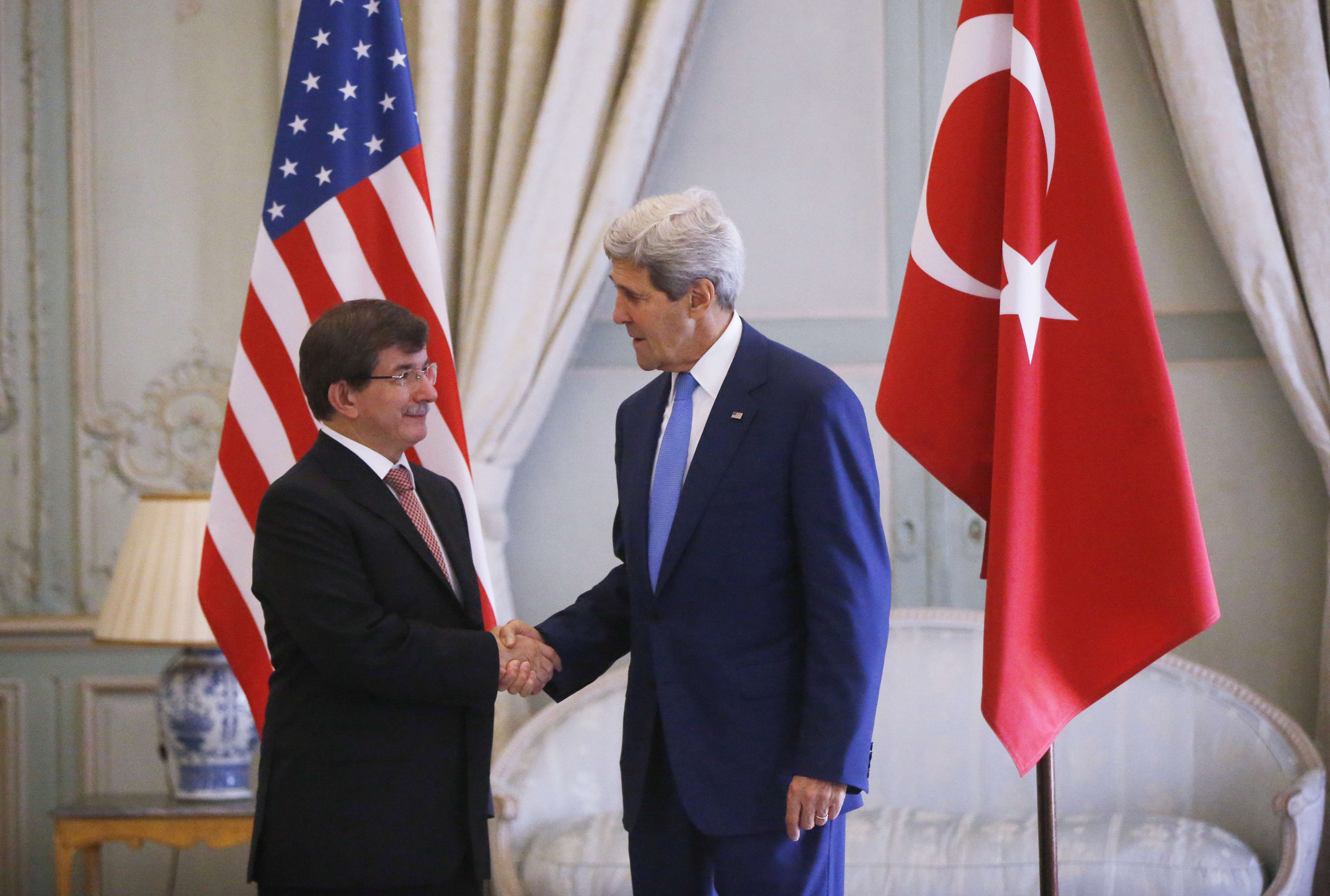 Kerry shook hands with Turkey’s foreign minister, Ahmet Davutoglu, as dignitaries from around the world met in Paris Saturday to discuss the Gaza conflict.