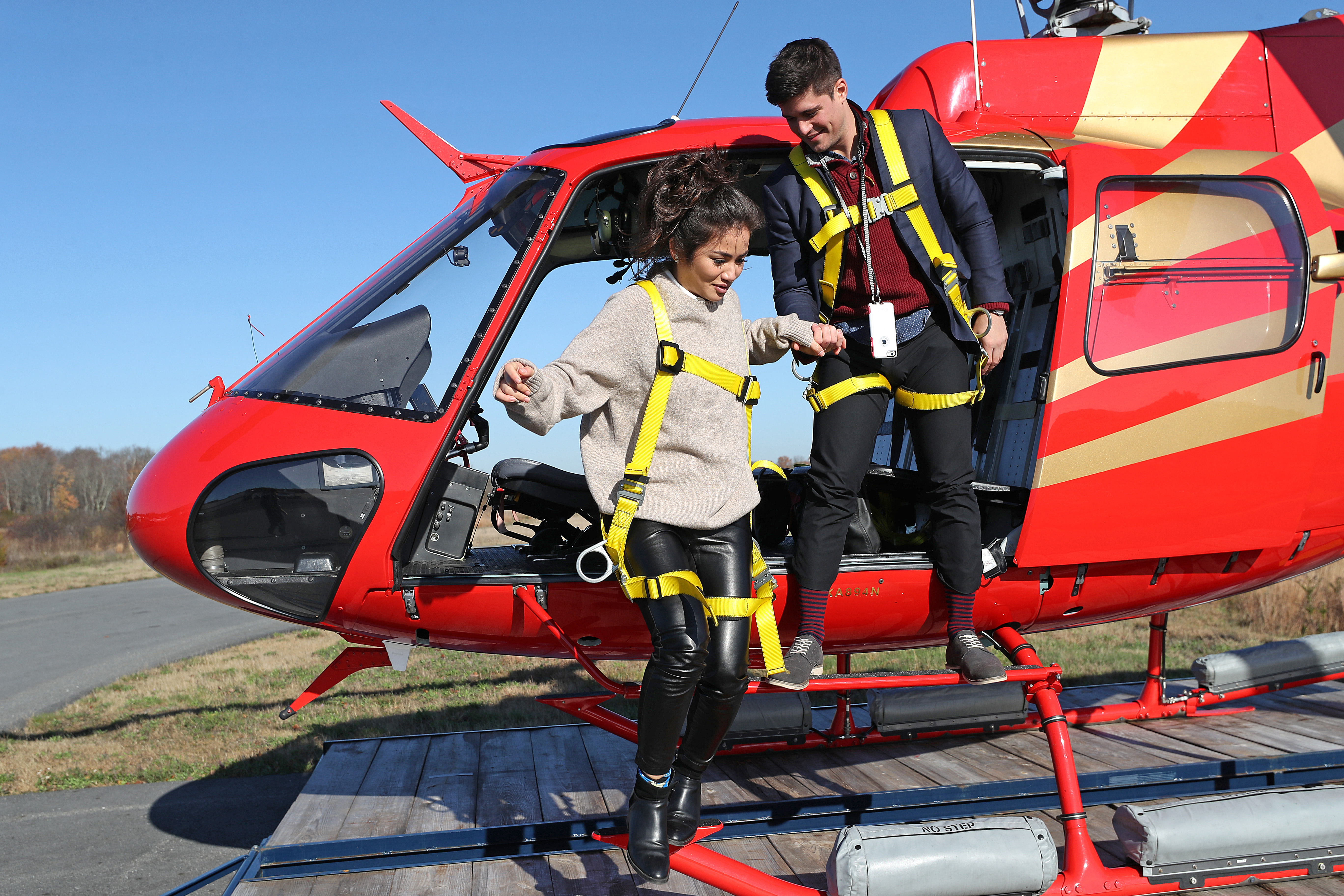 After returning to Norwood Airport, Quinn and Burrello leave the helicopter.