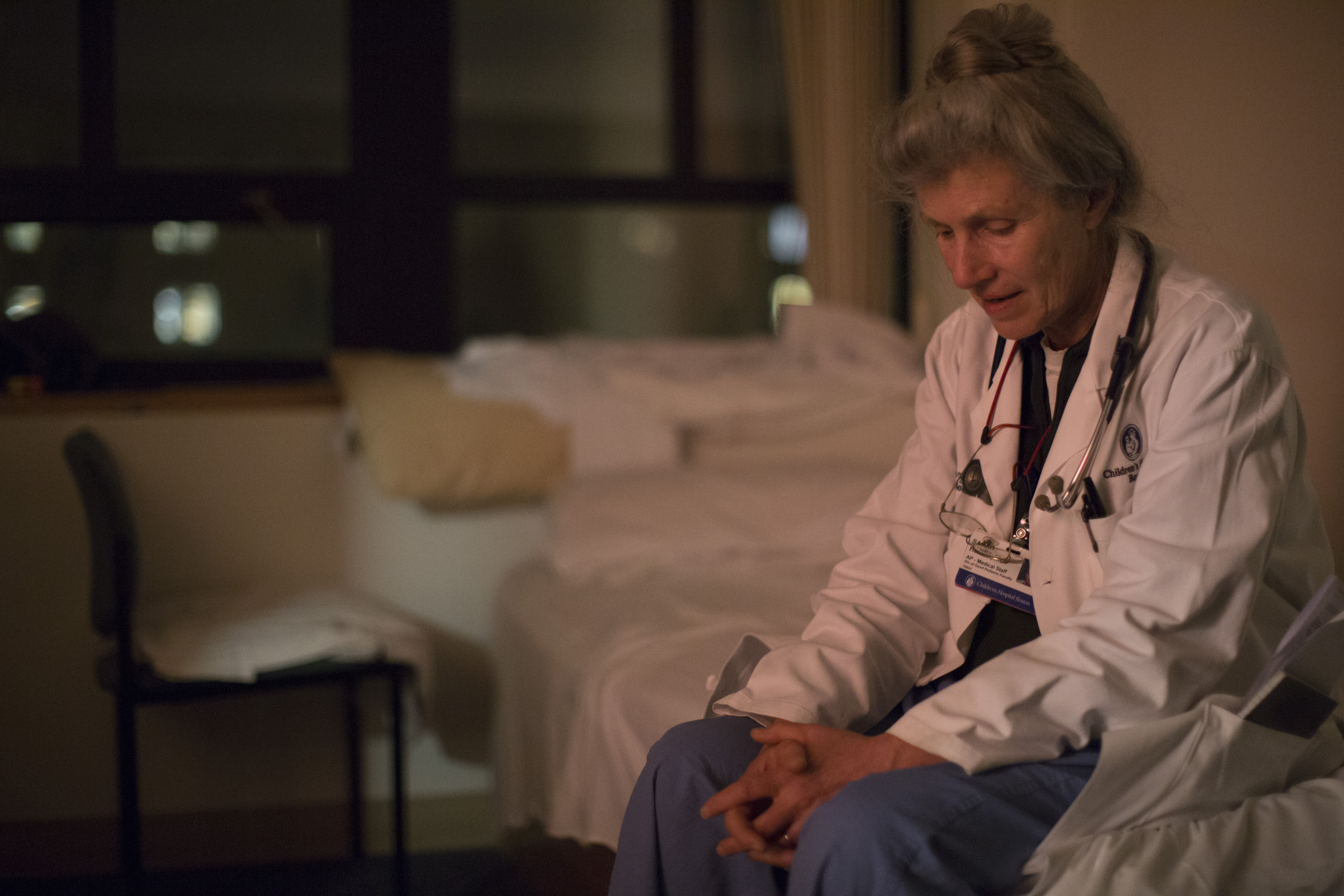 Dr. Henry is seen in a call room that is equipped with a small bed.