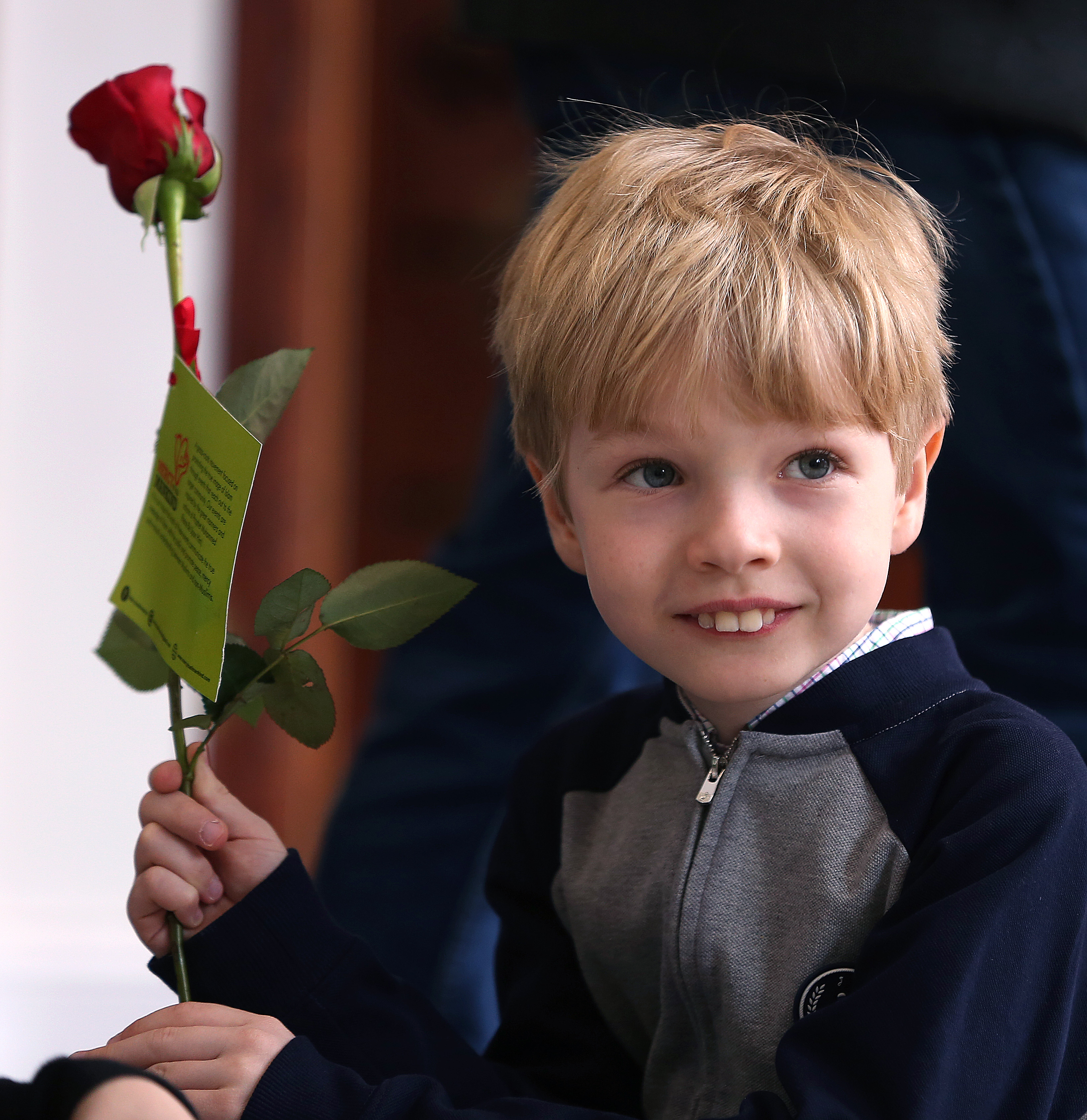 Kasim Kulovic, 8, of Arlington, handed out roses to visitors. He's been attending the mosque for about five years.