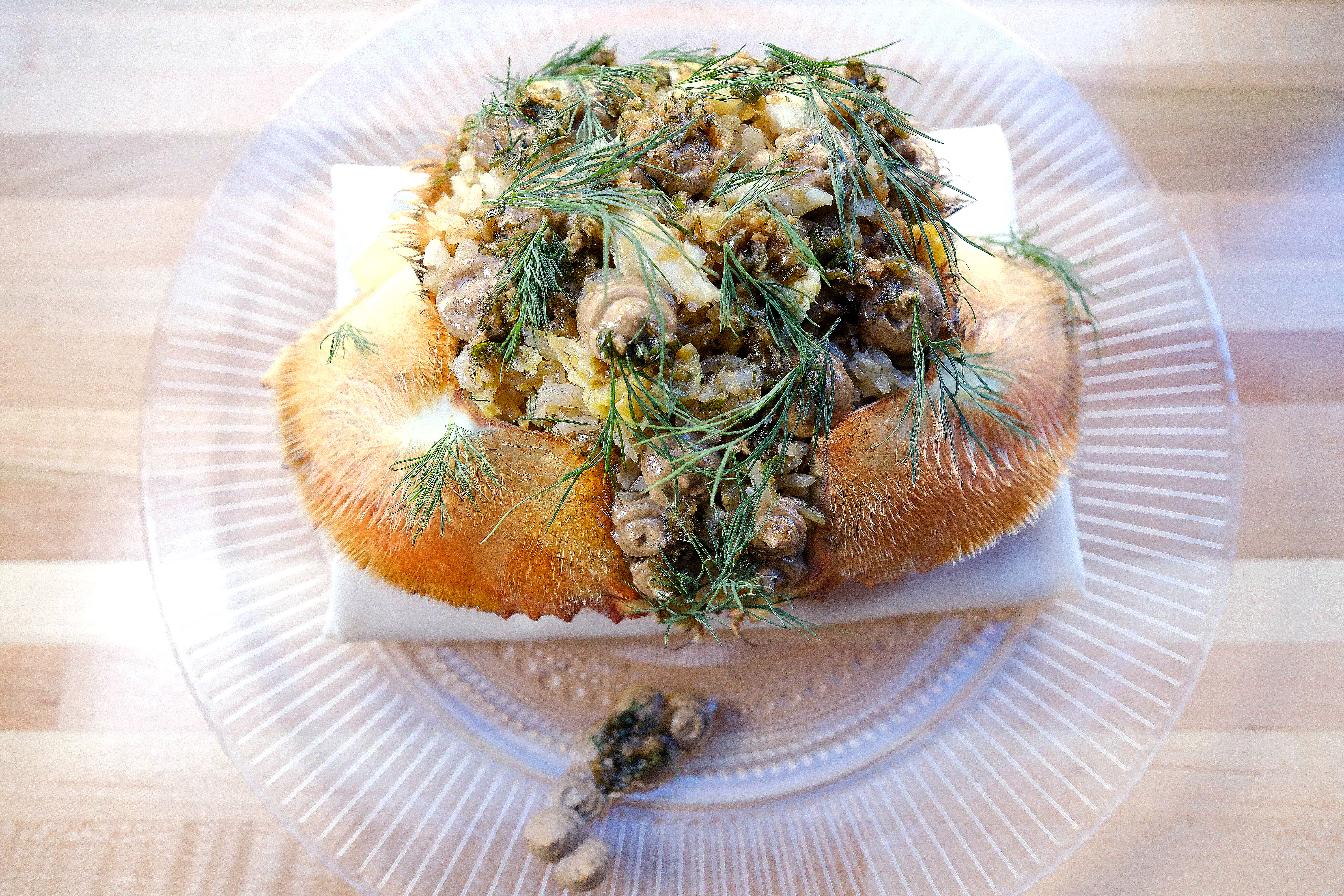 Fried rice with Dungeness crab, strikingly served in the creature's shell, with ginger-scallion vinaigrette and black garlic.
