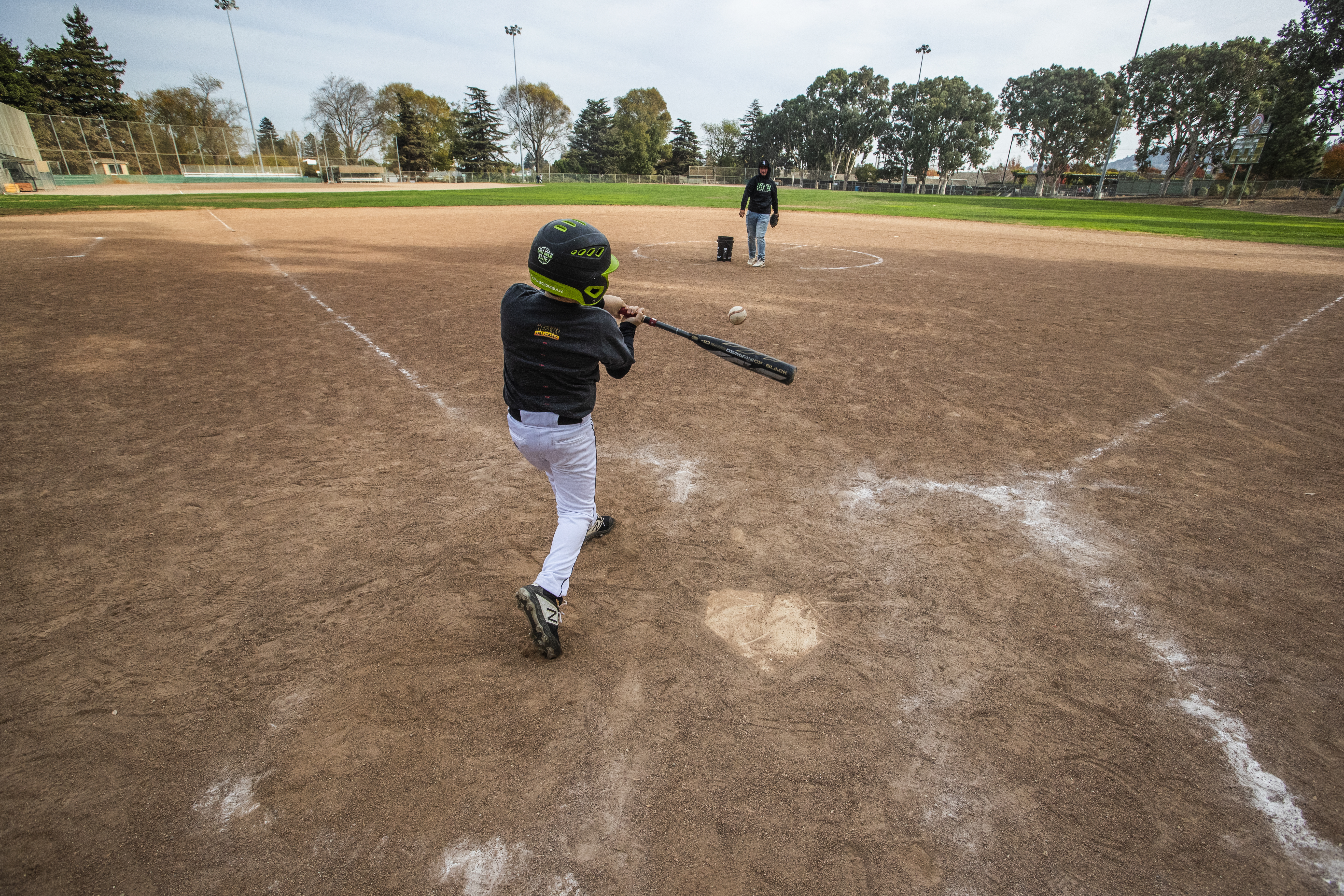 Saxon Lucia takes batting practice at Chanteloup Field, where Tom Brady played baseball as a kid.