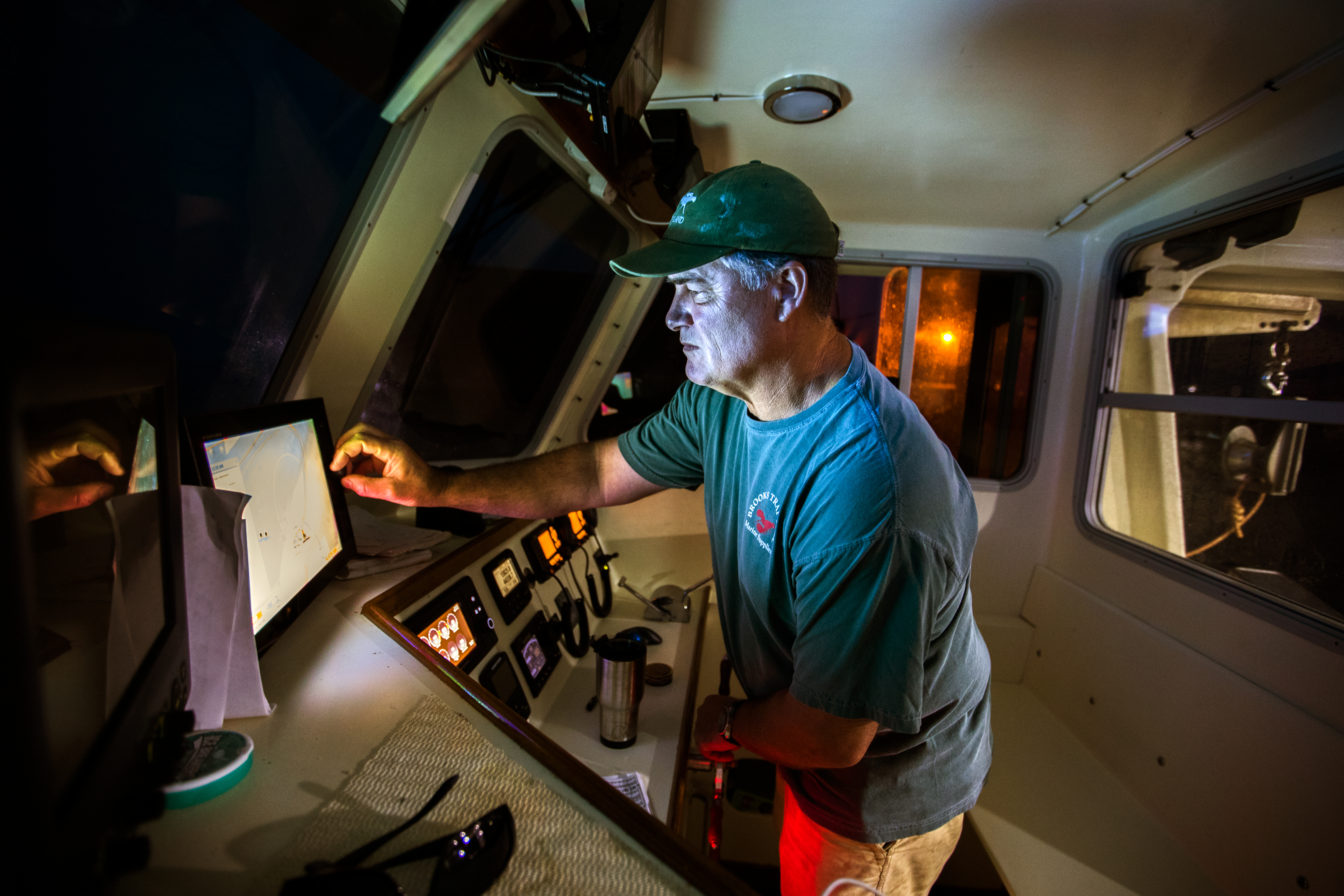John Farrell checks his charts at 4:30 a.m. before going out on his lobster boat Seaweed.
