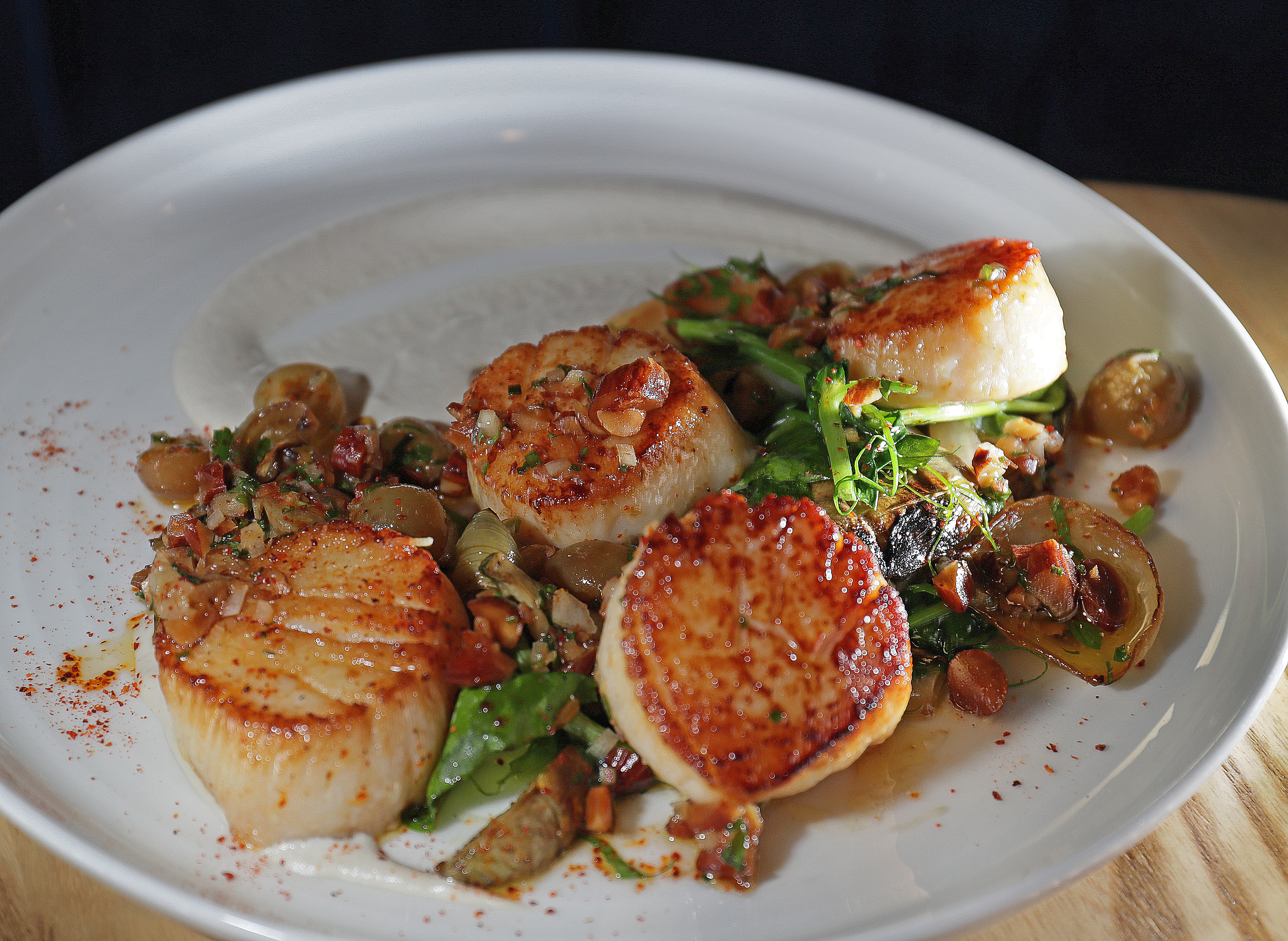 The New Bedford sea scallops, which includes artichokes, vidalia onions, grape, and almond salsa verde.