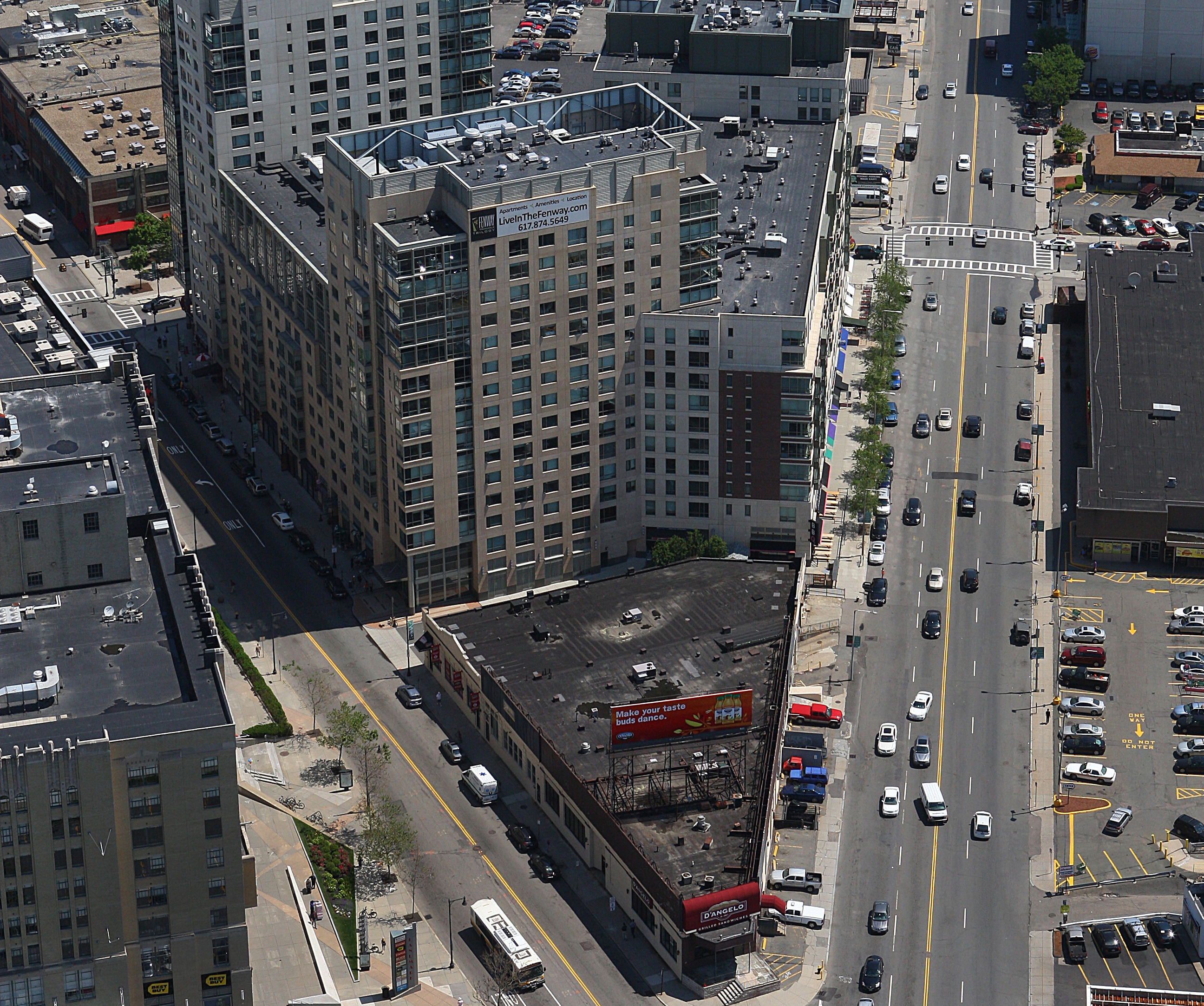 The triangular site would get a tower that would include homes and retail.