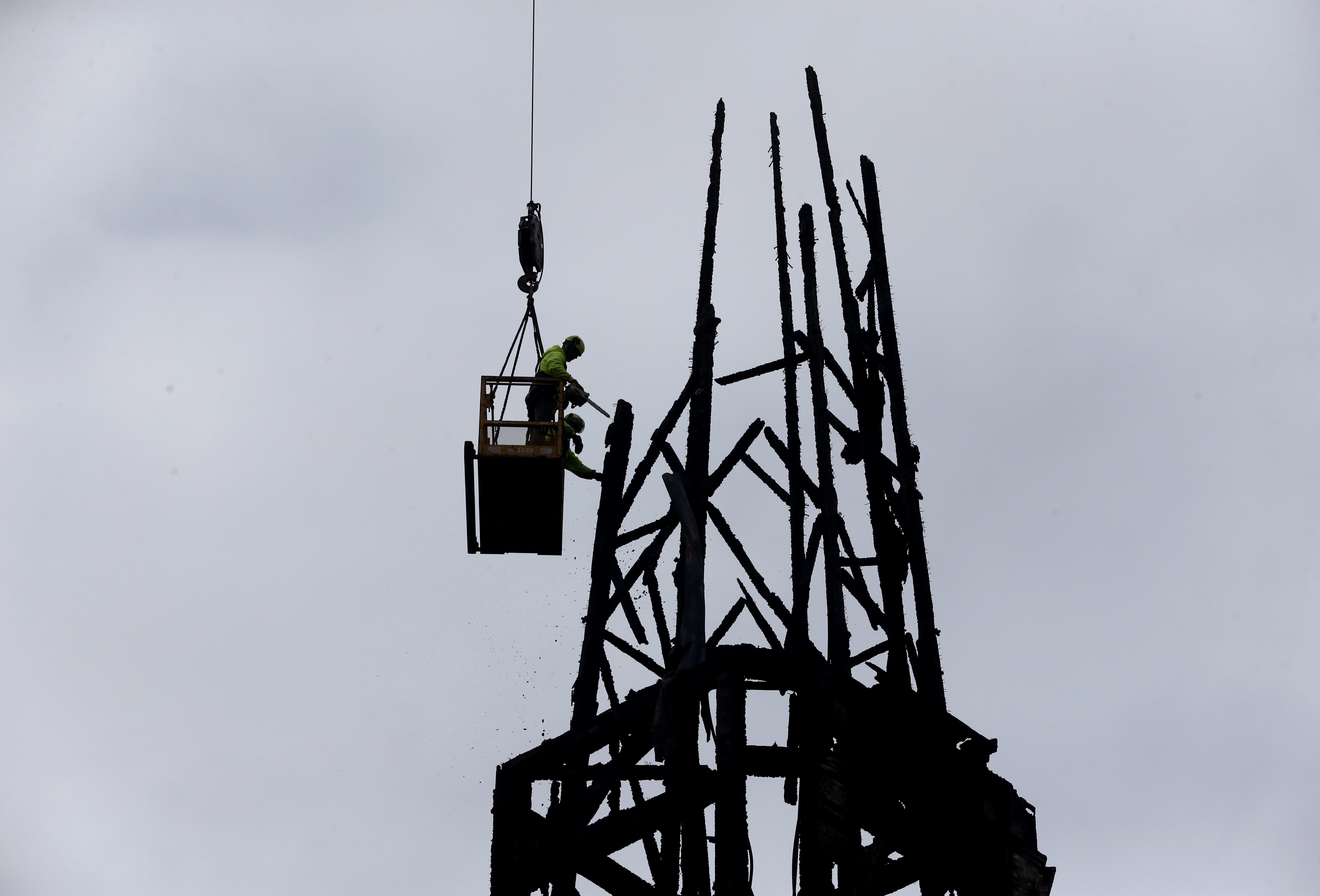 A crew from Pathfinder Tree Service worked on removing the spire from the fire gutted First Baptist Church on Wednesday morning.