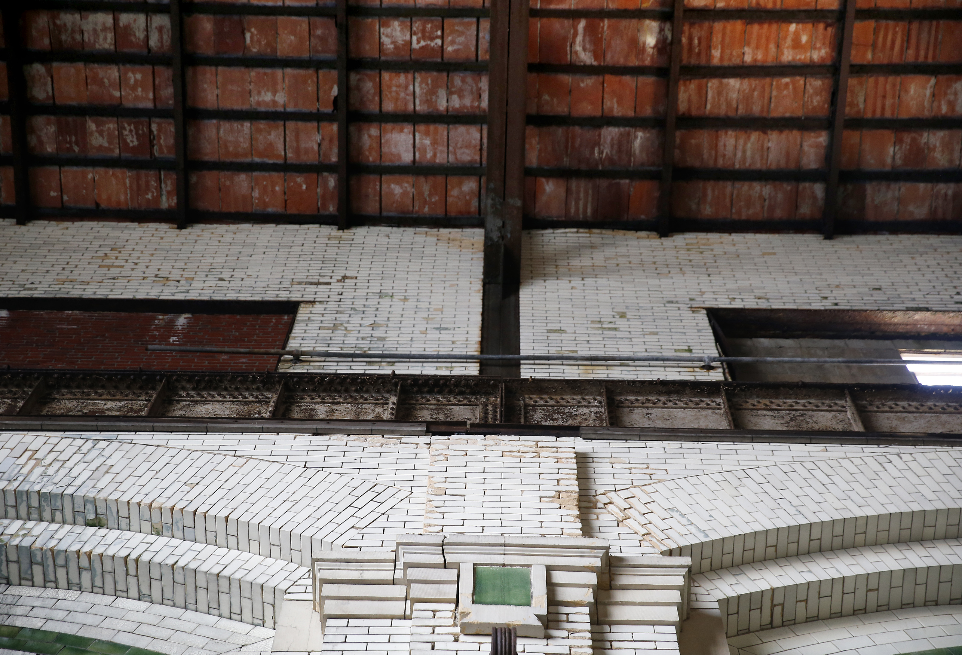 Tall tiled walls lead to the soaring ceiling of the L Street Power Station.