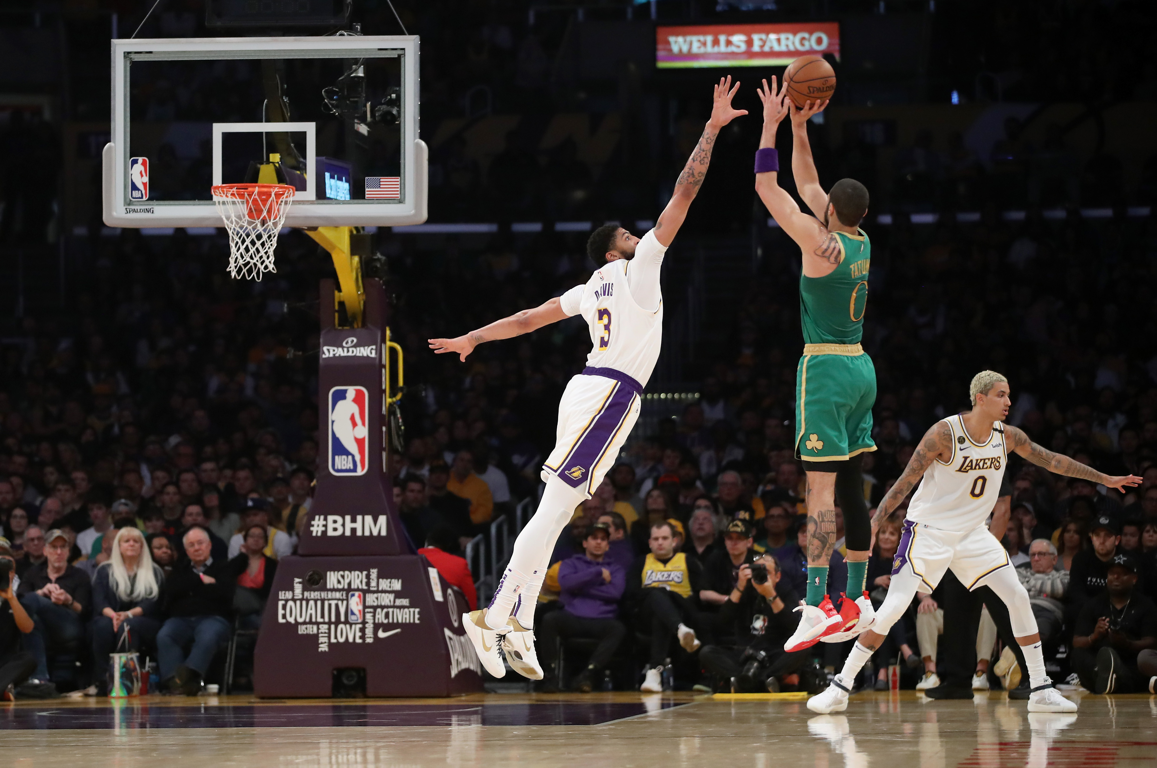 Jayson Tatum gets off a jumper earlier this month against Anthony Davis.