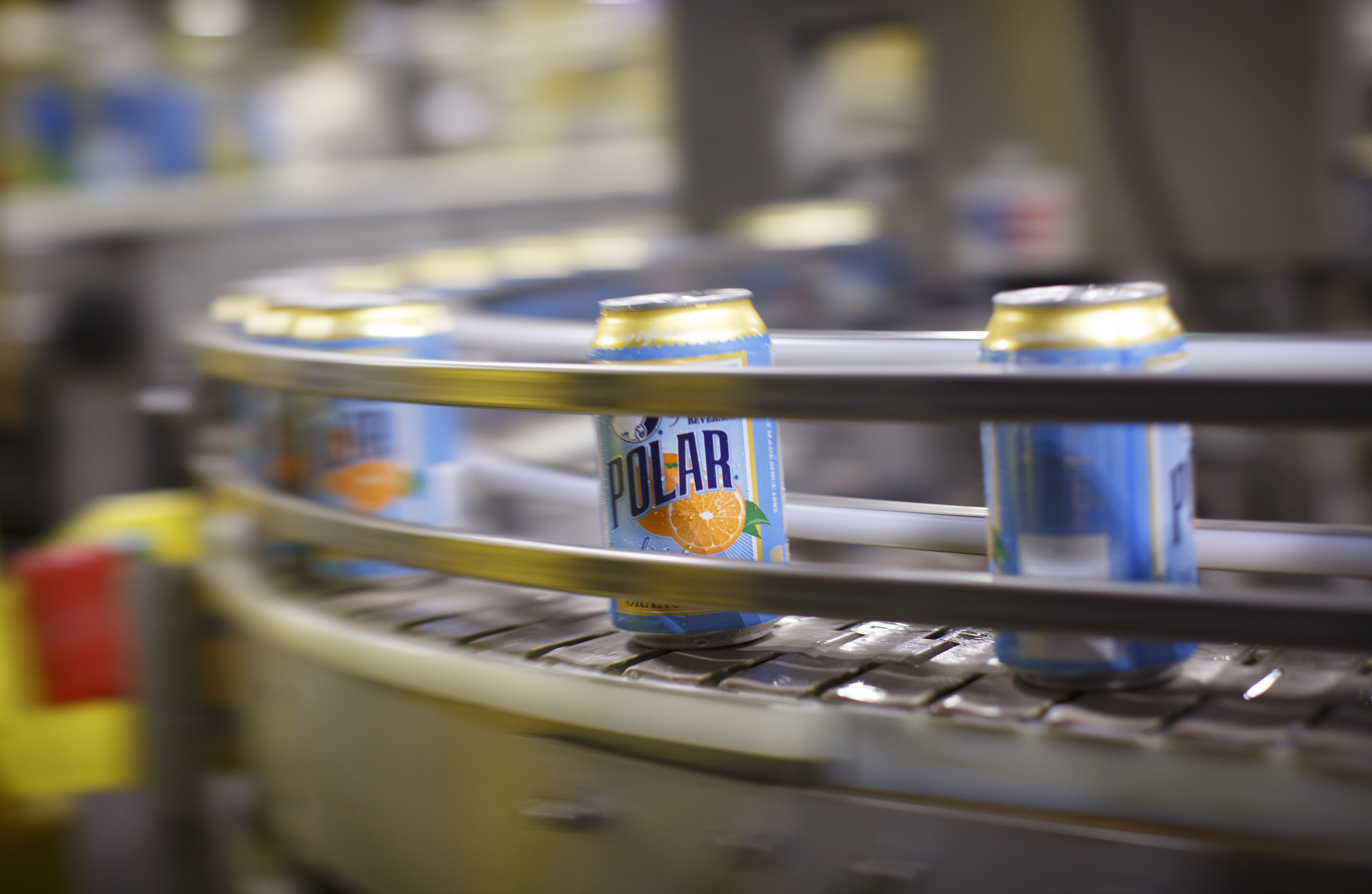 Thousands of of cans are directed along a conveyor belt at the Polar Seltzer production facility in Worcester.