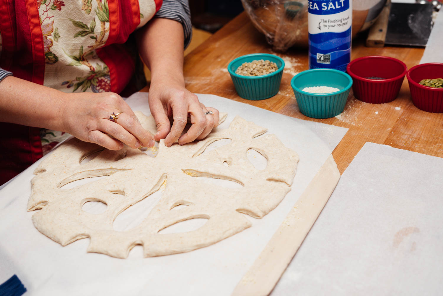 Cheryl Holbert working with dough during a bread-baking class.