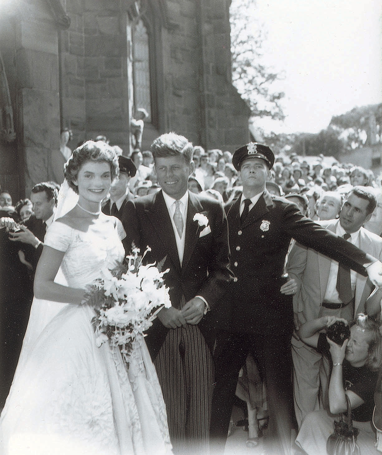 Four of the negatives show the newlyweds, two show the entire wedding party, and the rest show the cake, reception, and wedding attendees, according to the auction website.