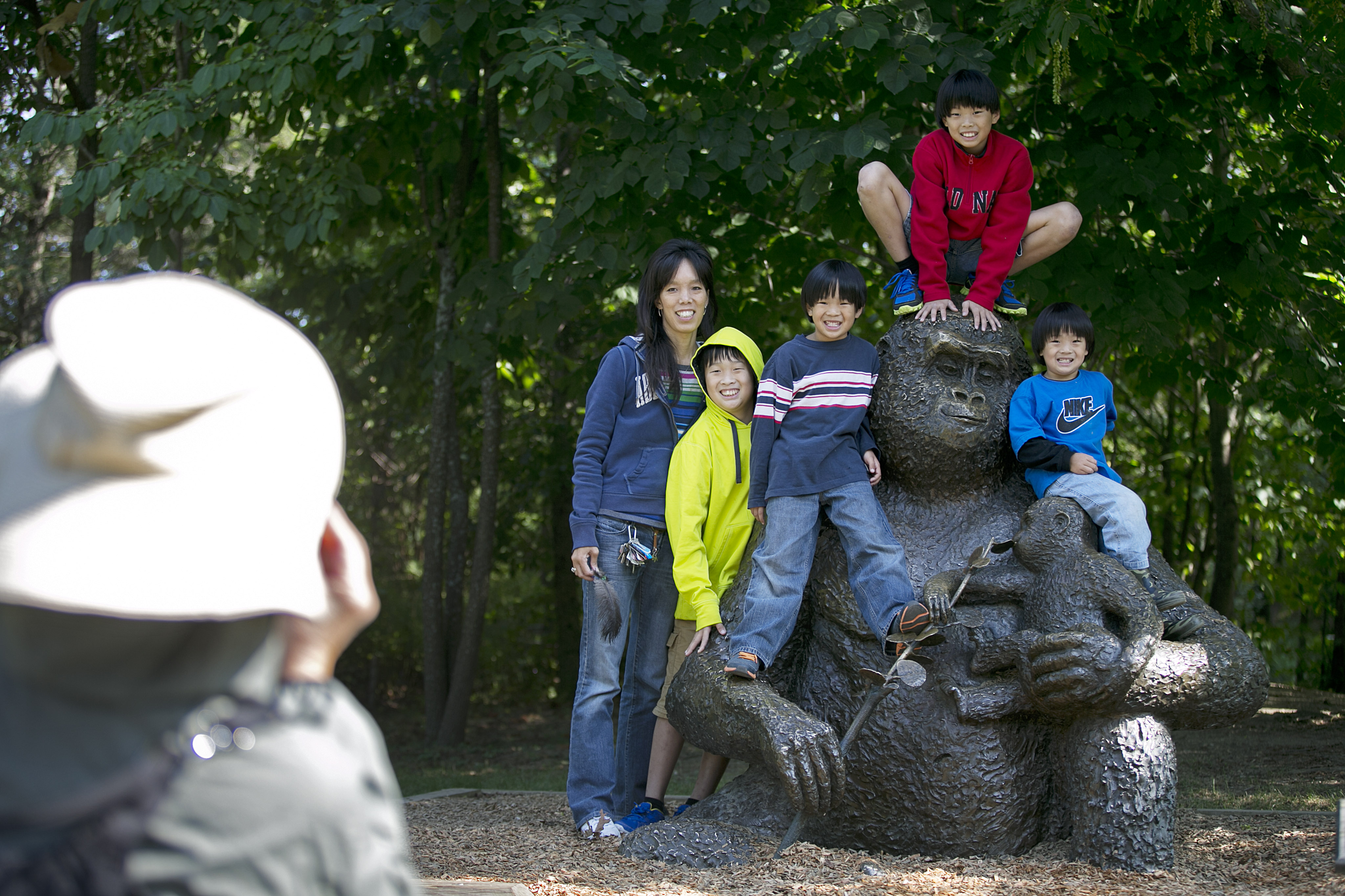 Genevieve Wu of Medford posed with her children outside the Tropical Forest at Franklin Park Zoo. Zoo New England, which also includes the Stone Zoo, recorded its best June with 105,000 visitors.