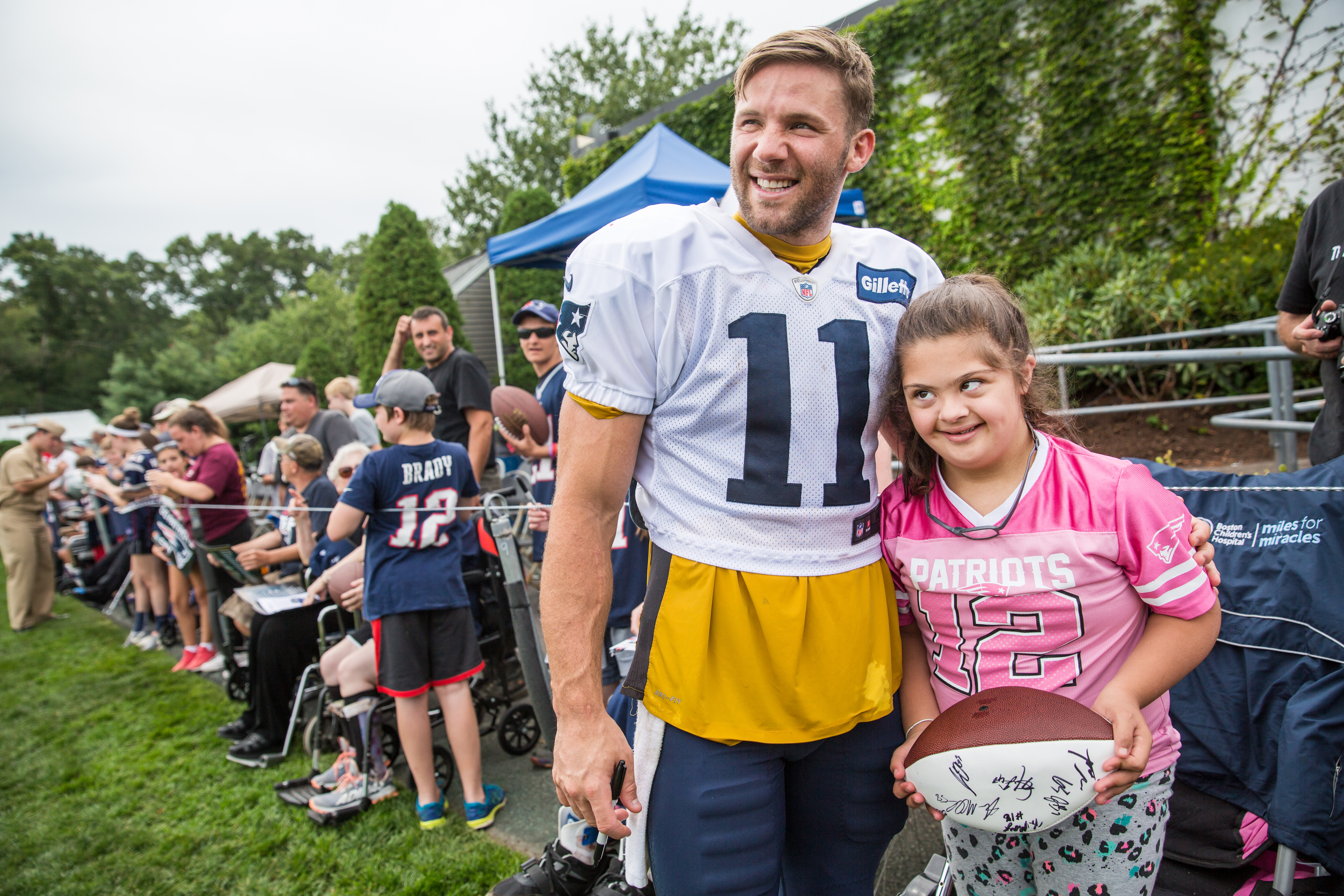 Julian Edelman posed for a photo with Maria Rahwan, 10, of Westwood, during a joint Patriots practice with the Jaguars held at Gillette Stadium.