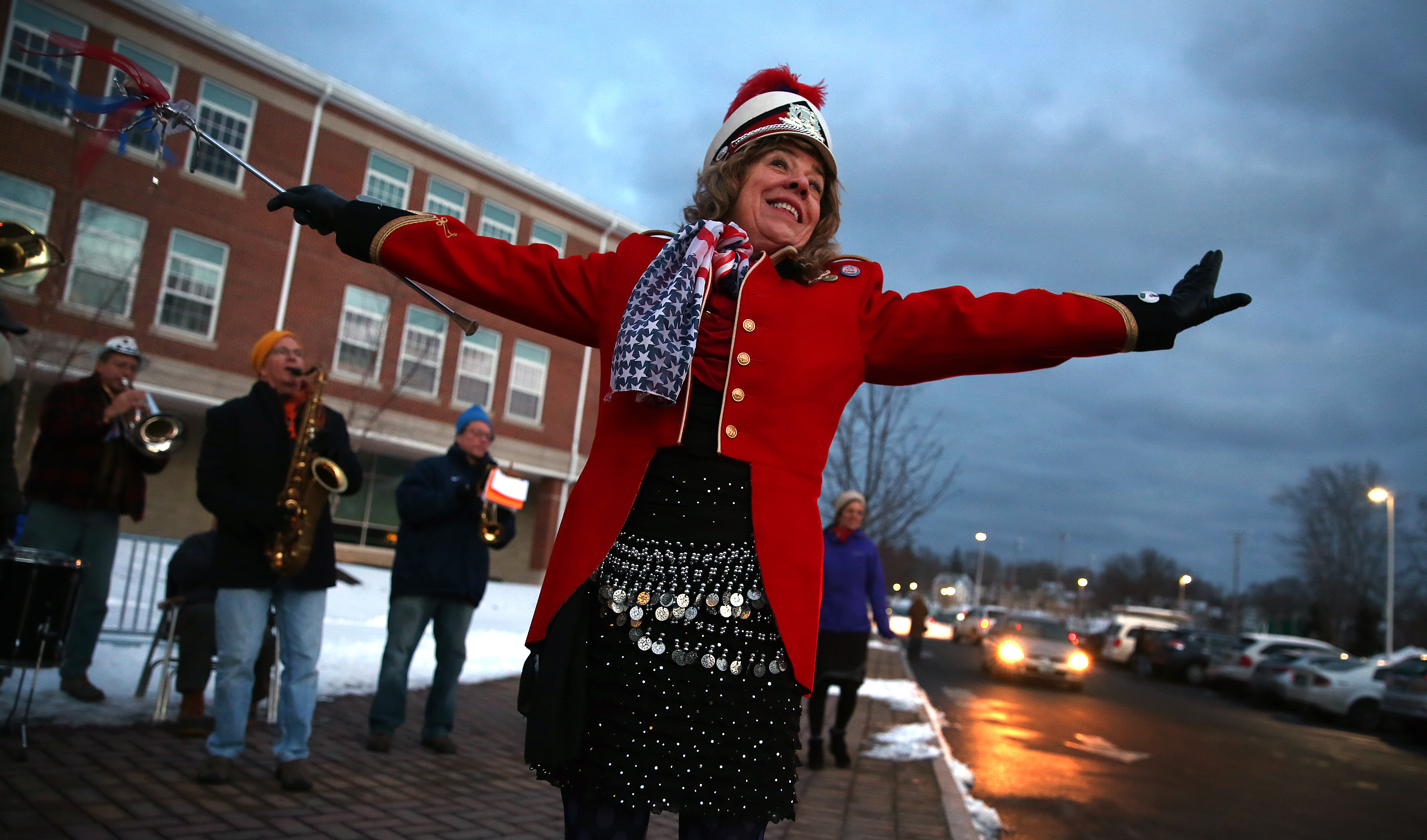 In Portsmouth, Pat Spalding, a member of The Leftist Marching Band, punctuated the end of the group’s song. “We’re here to celebrate democracy in its true form,” she said.
