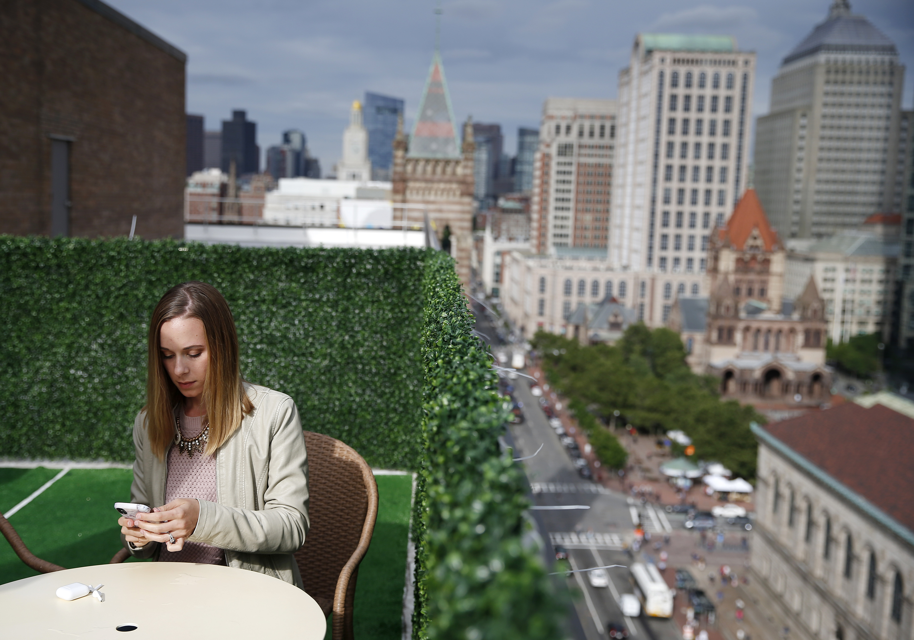 Hanna Berning, commercial marketing manager for Integrated DNA Technologies, works on the roof deck at The Wing.
