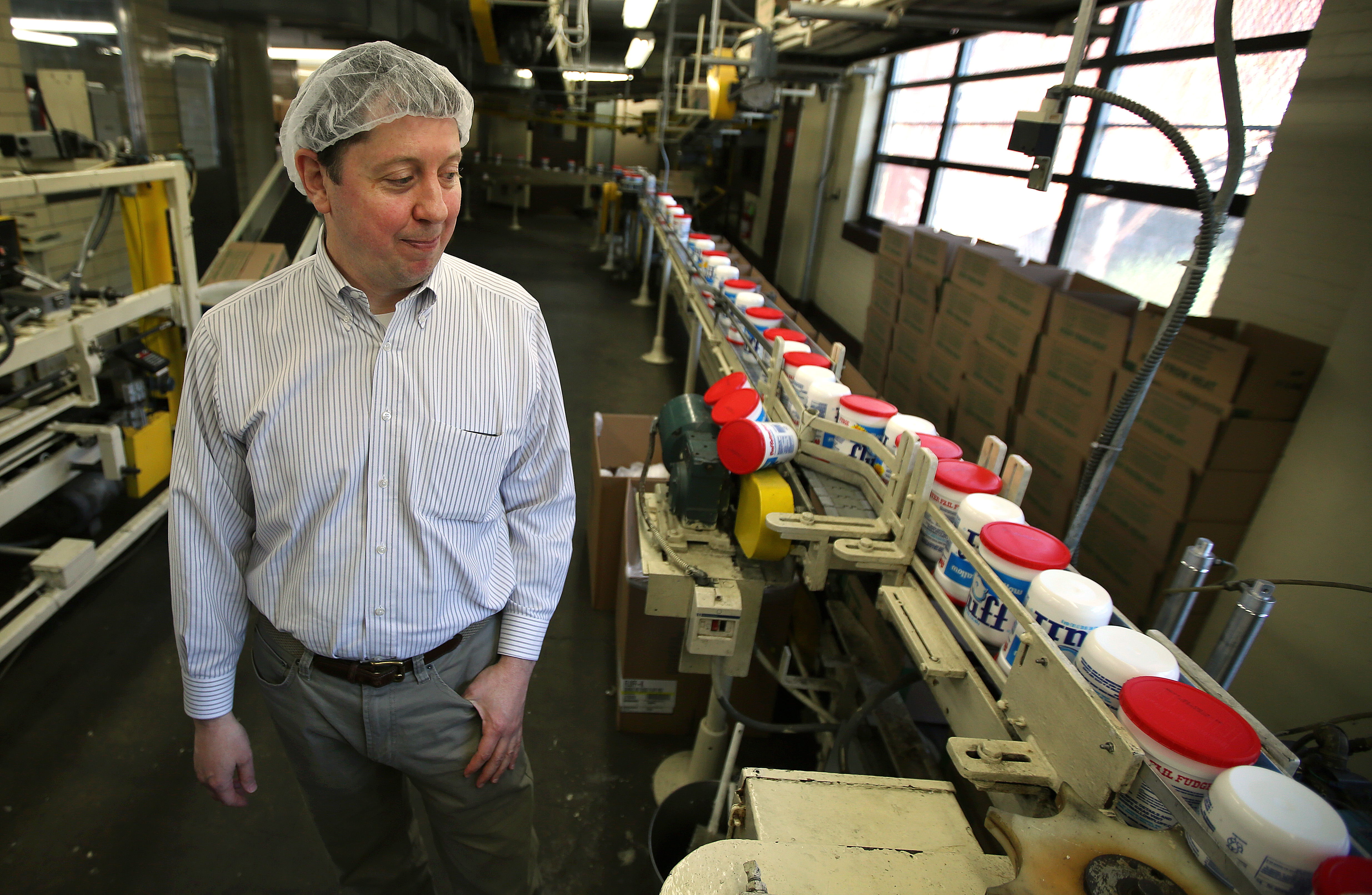 Jon Durkee, treasurer and vice president of Durke-Mower, the maker of Fluff, toured the packing area.