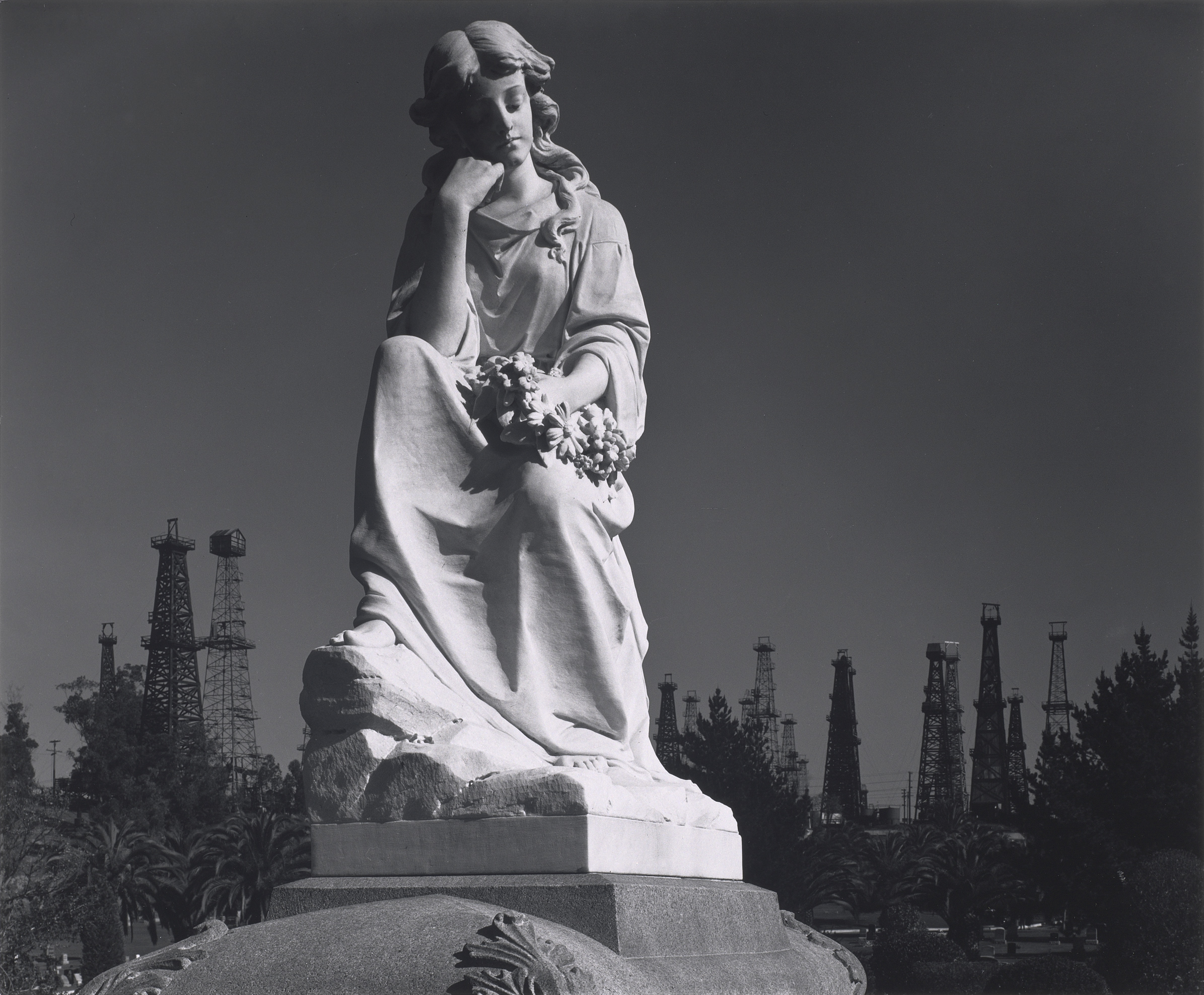 Ansel Adams’s “Cemetery Statue and Oil Derricks, Long Beach, California” will be included in “Ansel Adams in Our Time” at the Museum of Fine Arts Dec. 13-Feb. 24.