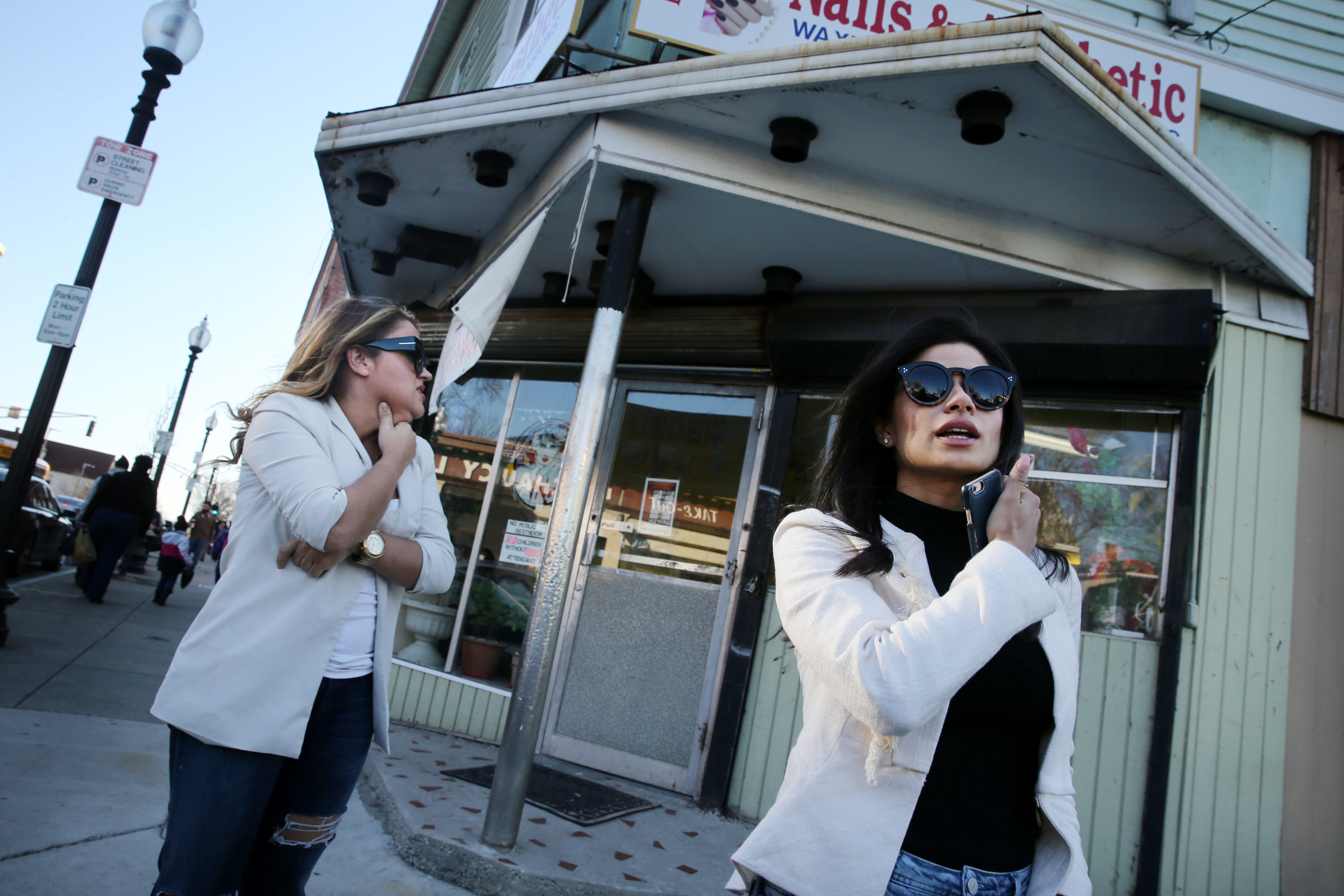 Guerrero (right) and her lifelong friend, Stephanie Bolivar, in Egleston Square near where Guerrero lived as a teenager.