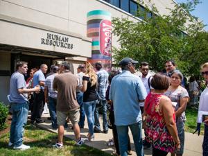 In July, employees waited to pick up their last paychecks outside the Necco factory in Revere, which had been one of the city’s biggest employers.