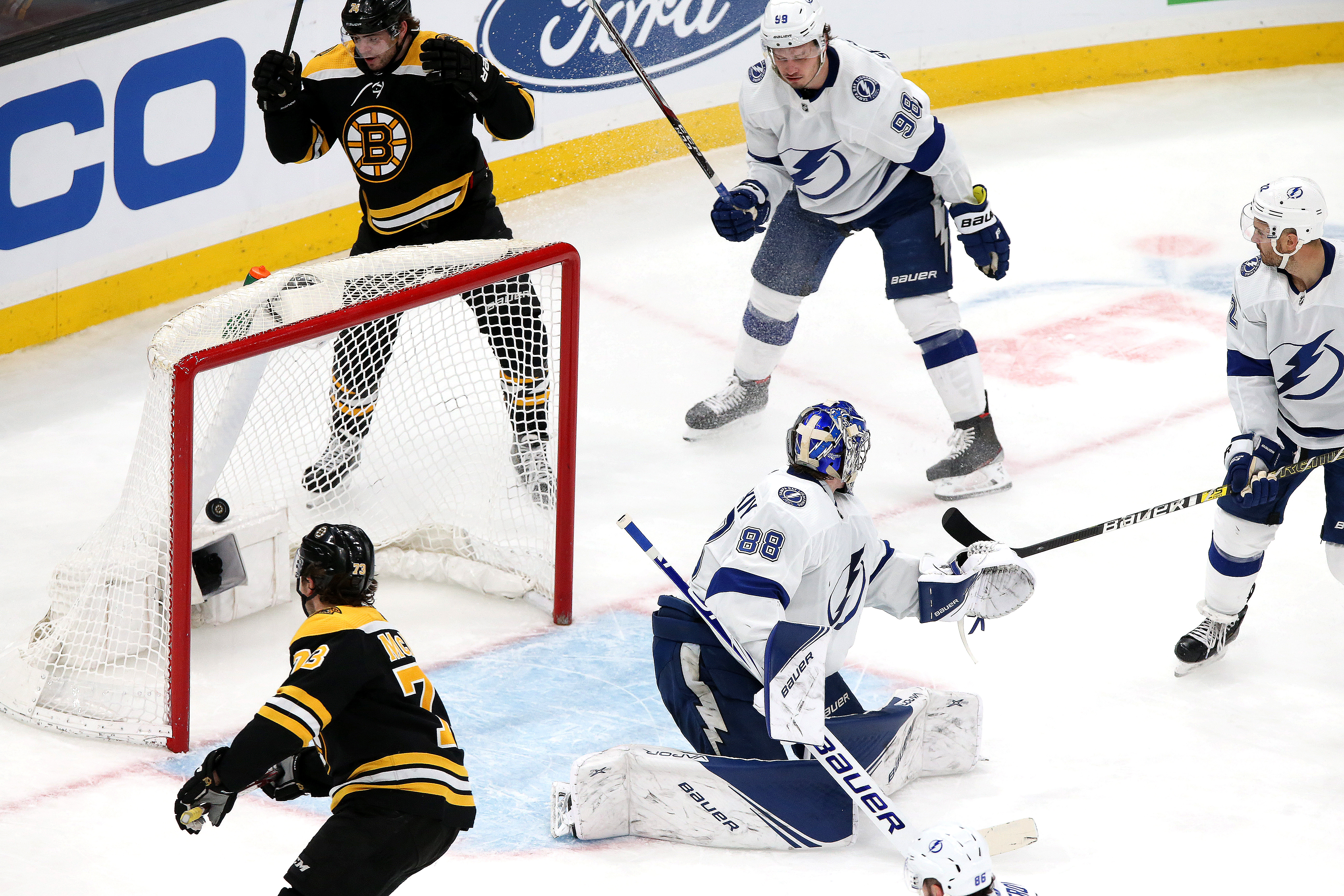 Bruins defenseman Charlie McAvoy (bottom left) scores in the second period.