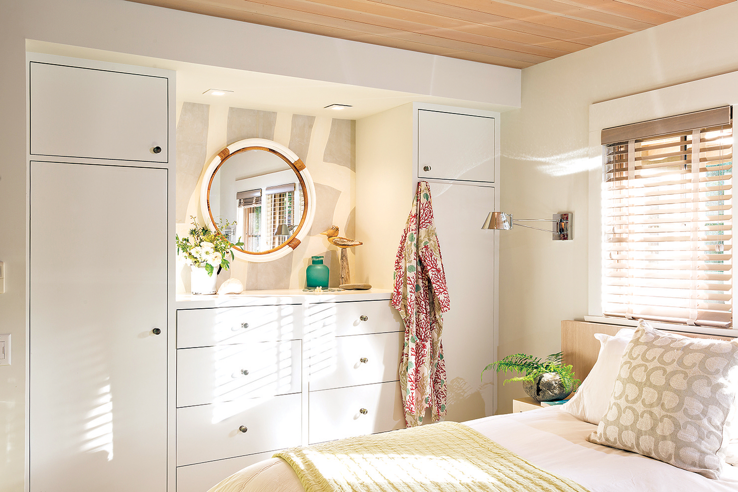 Designer Mary Rentschler reconfigured the master bedroom closet as a built-in bank of dressers.