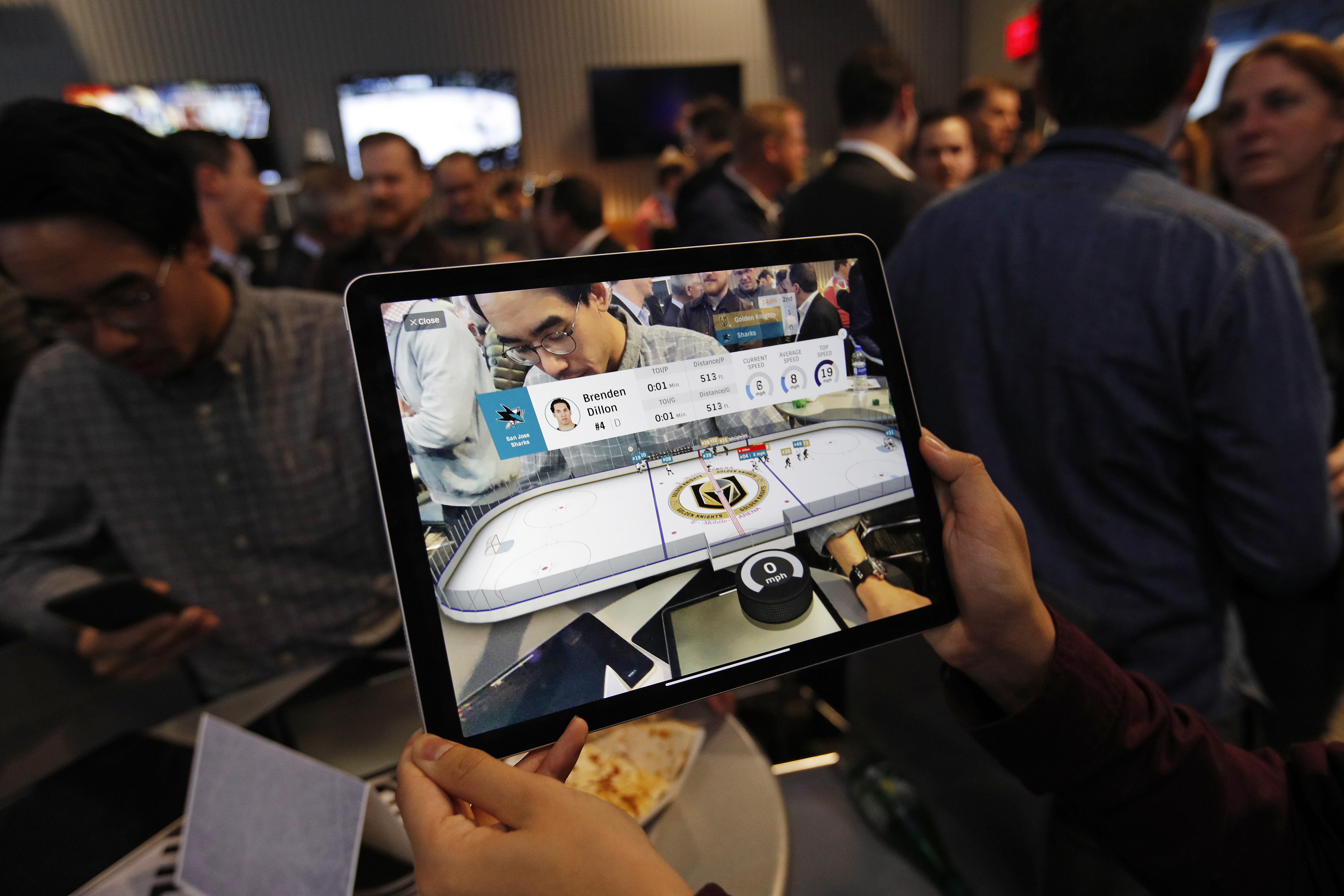 People watched real-time puck and player tracking technology during a January game between the Sharks and the Golden Knights.
