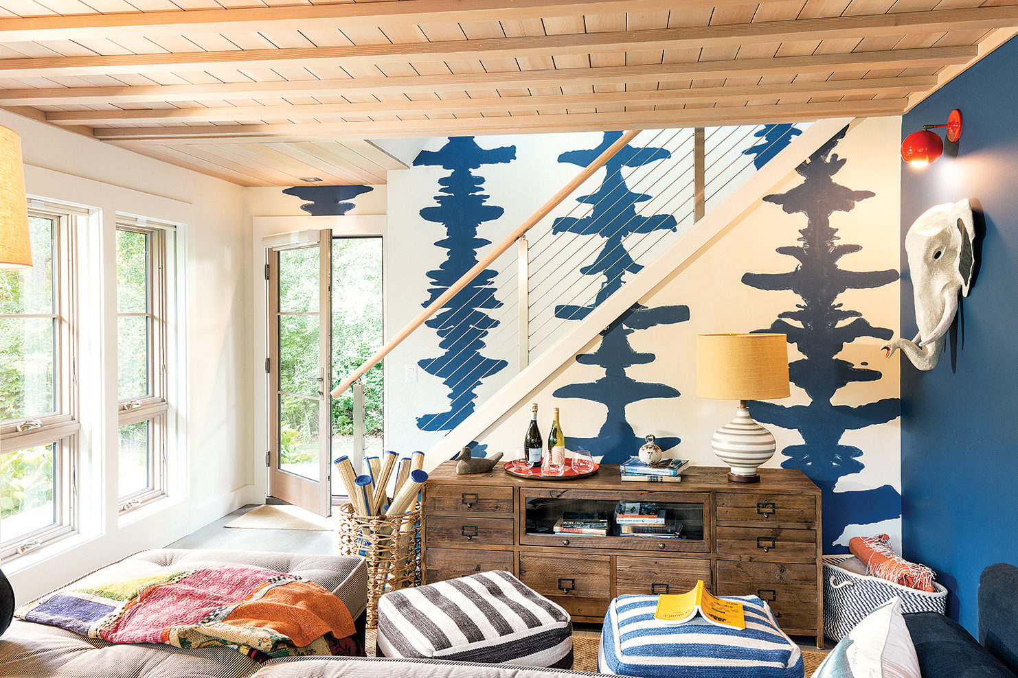 A new staircase was built to access the second-floor addition. The bold wallpaper is by Porter Teleo.