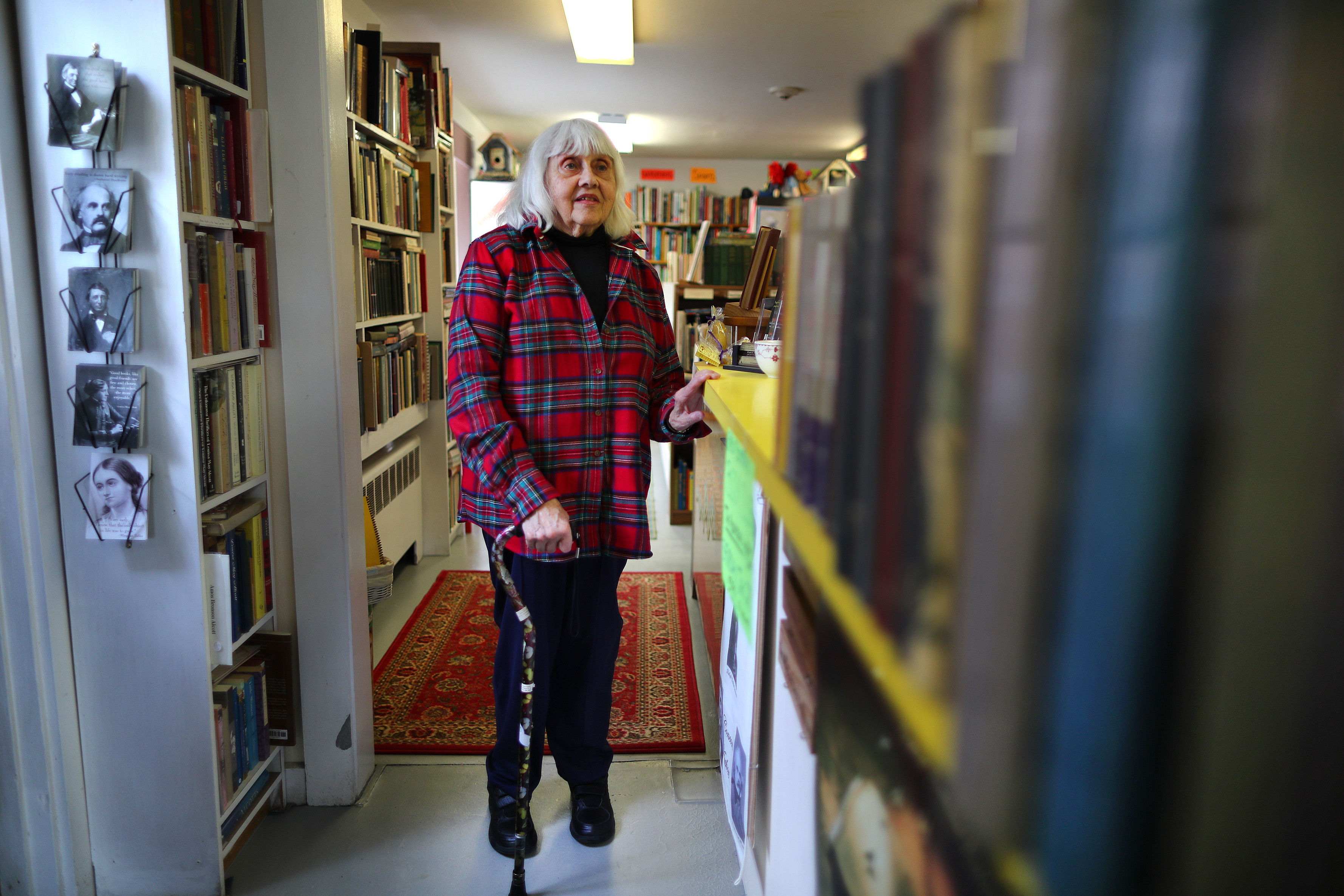 Eugenia Kaledin viewed her former husband’s books at Barrow Book Store in Concord.