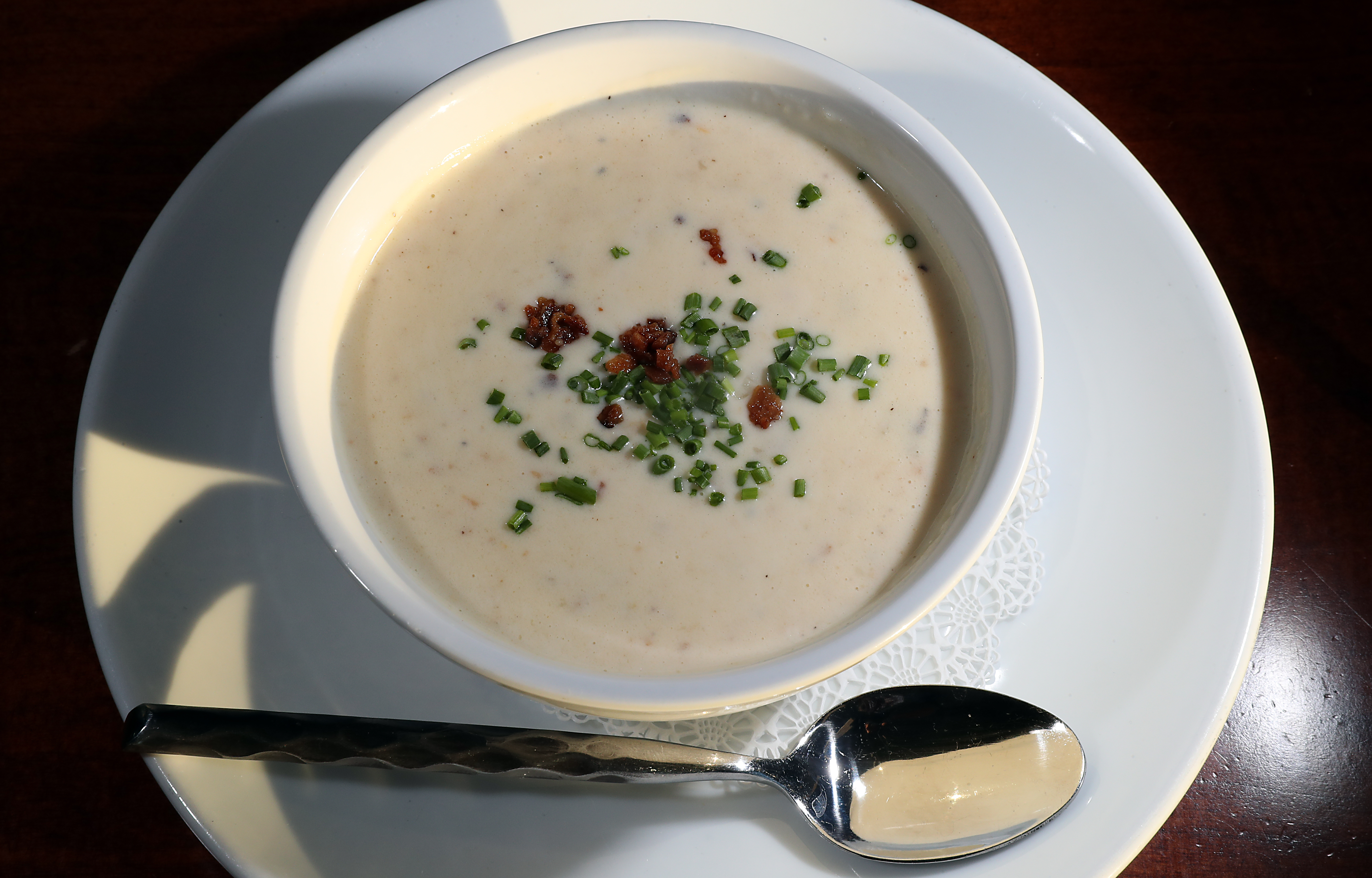 The claim chowder was chock-full of clams, bite-sized white potatoes, and applewood-smoked bacon.