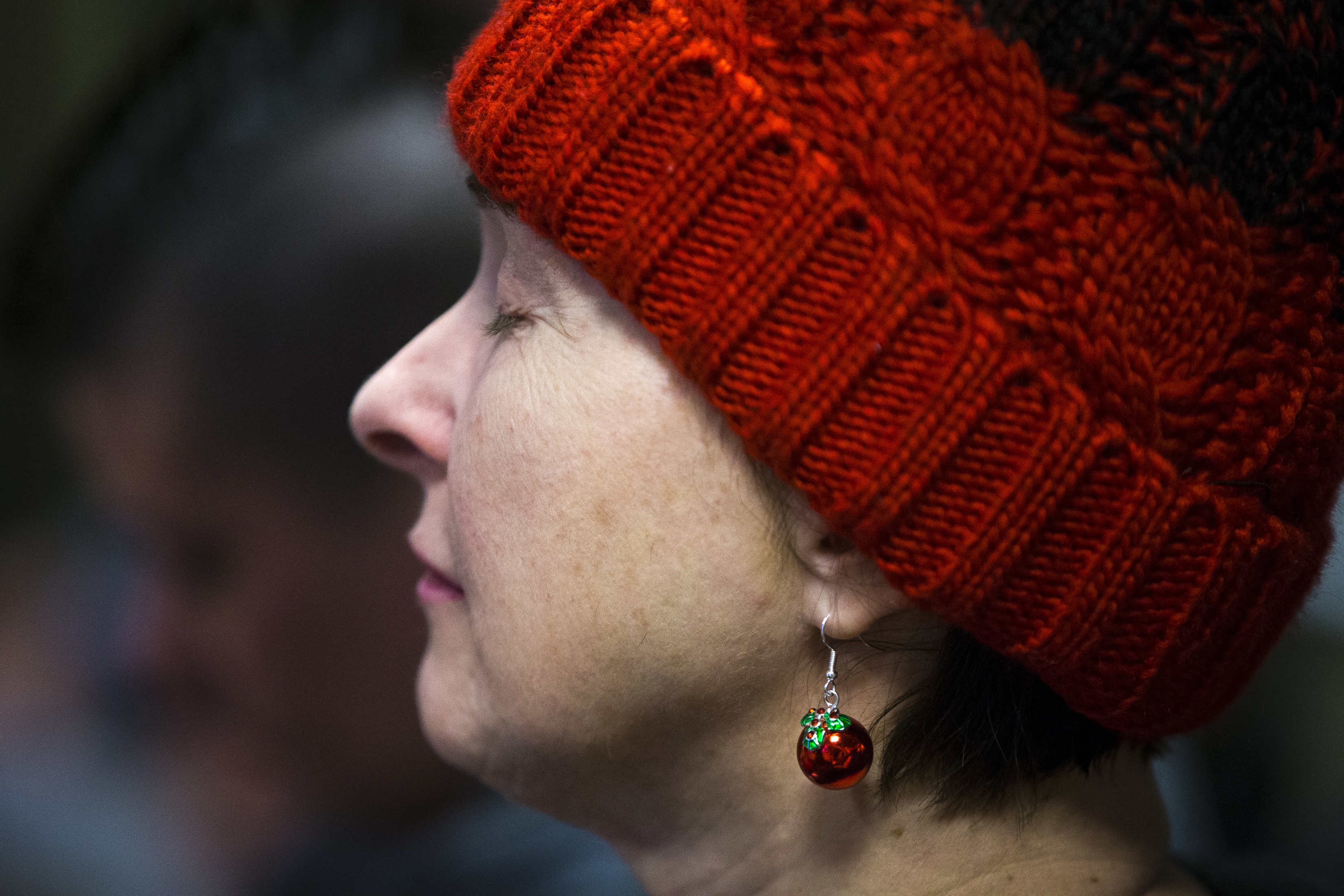 Vladislava Kotlyar closes her eyes as she joins in prayer at St. Francis House in Boston on Wednesday.