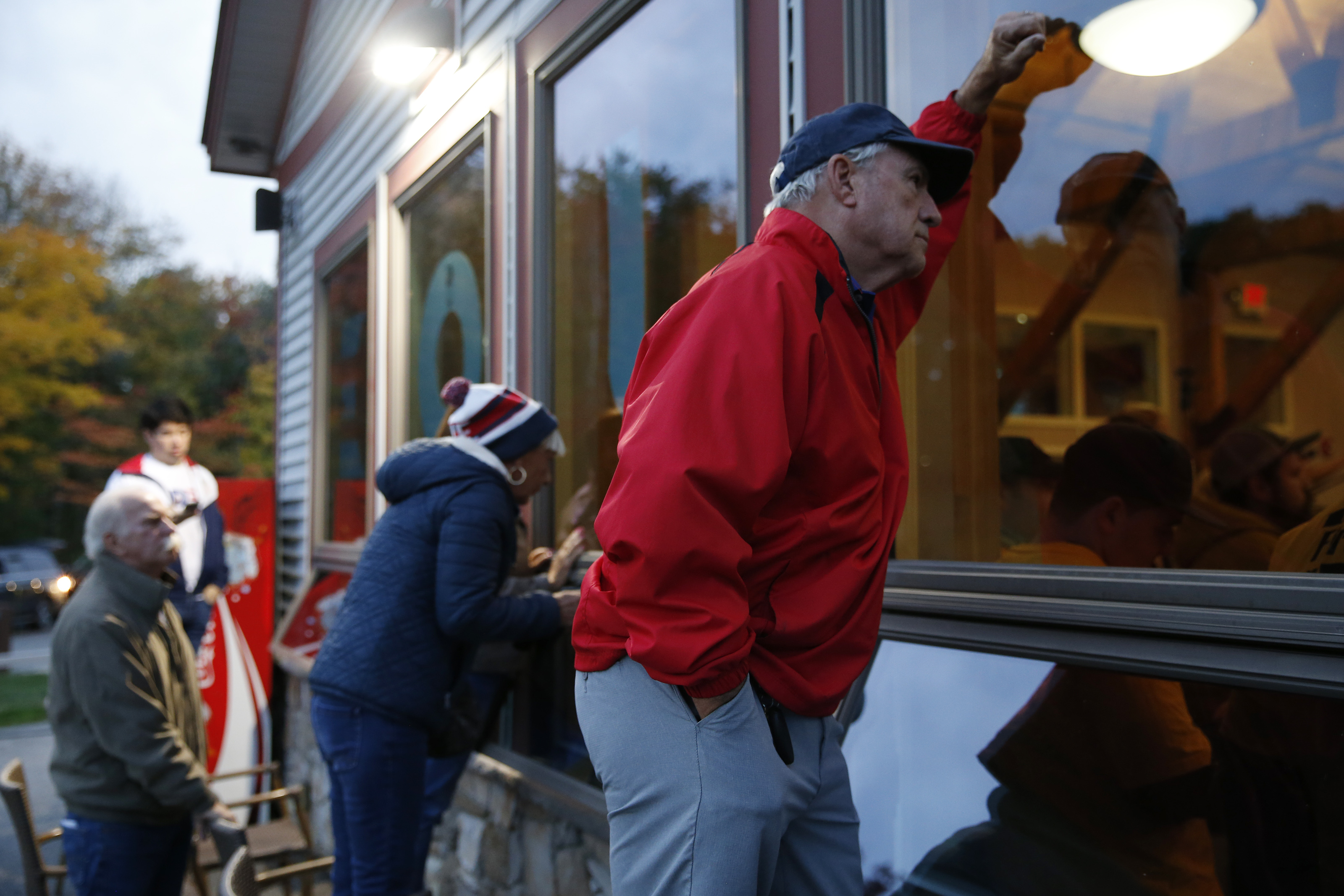Spectators watched from outside as Joe Biden spoke in Manchester, N.H.