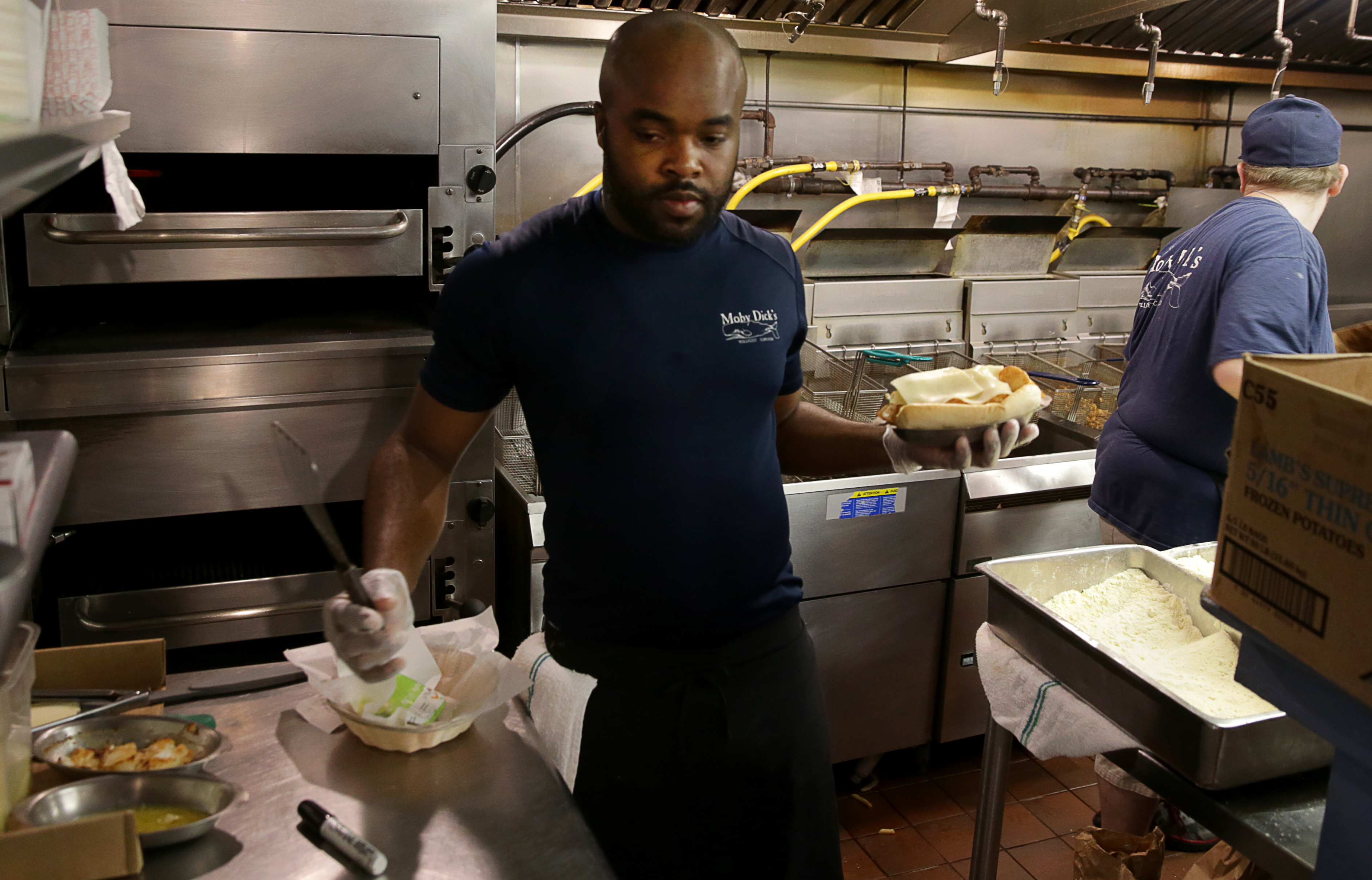 Kevon Sinclair, from Jamaica, holds an H-2B work visa. He’s working for a third season at Moby Dick’s.