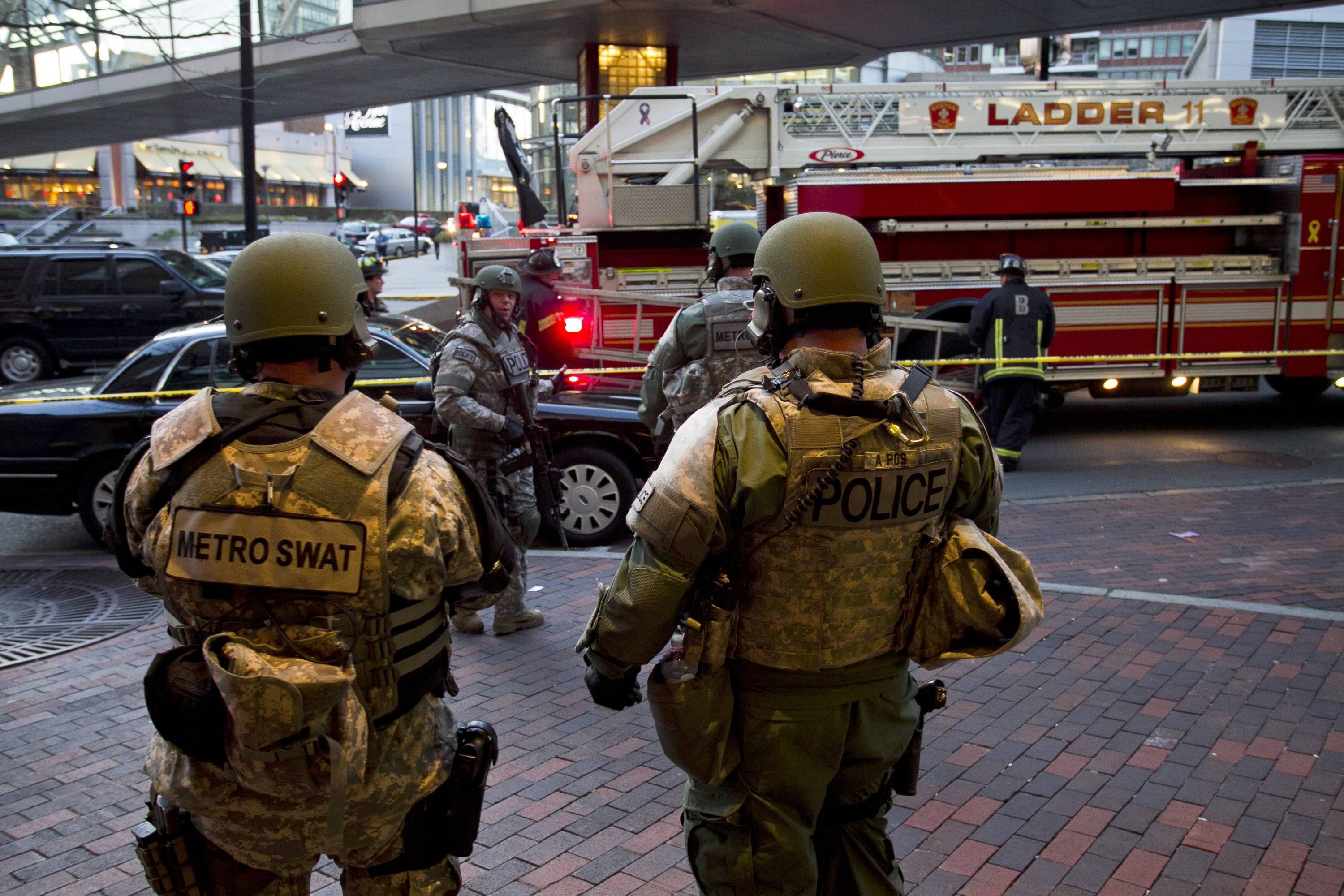 SWAT officers stand guard in Boston after the explosions.