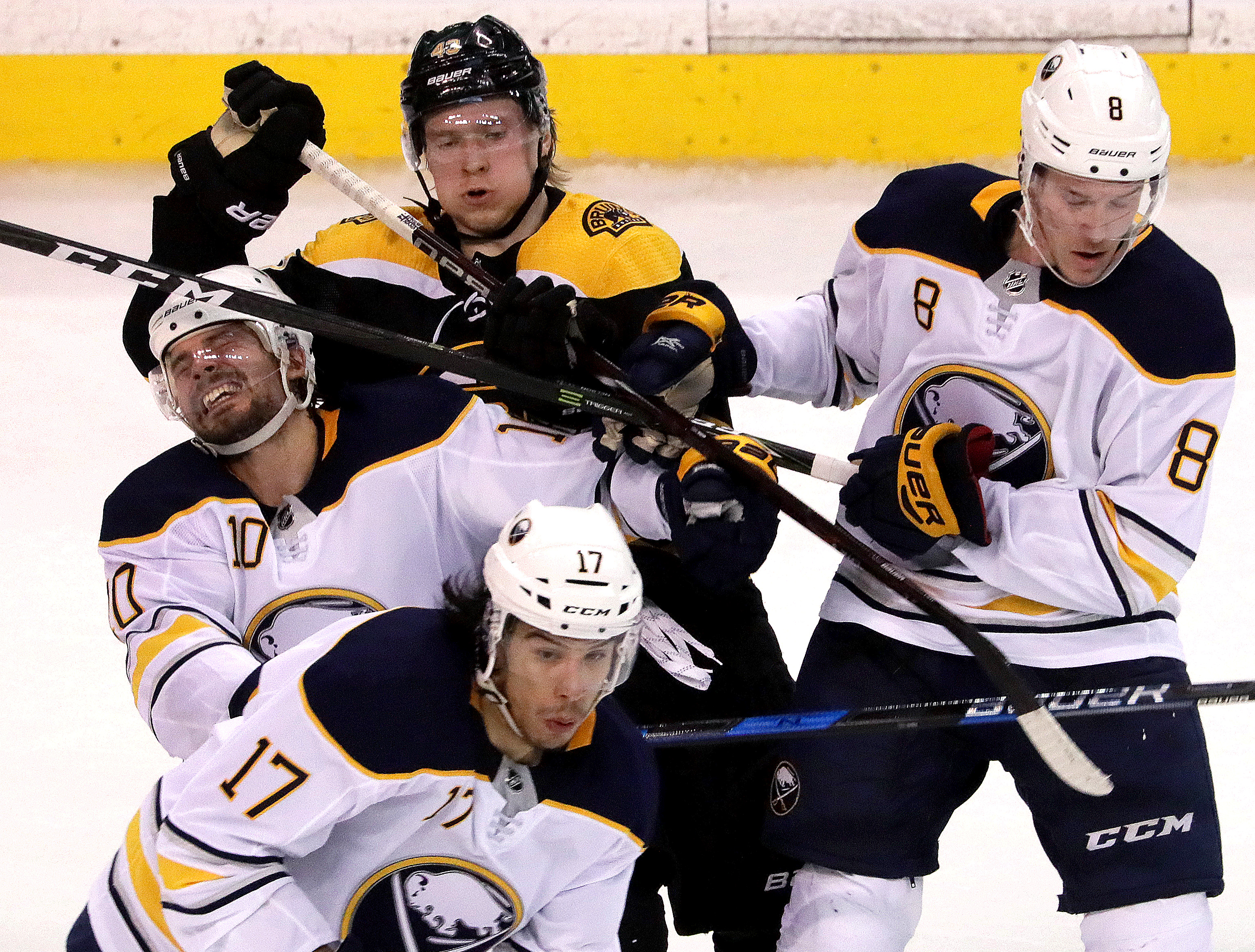The Sabres’ Jacob Josefson (10) takes a stick in the face, courtesy of teammate Casey Nelson during the third period Saturday.