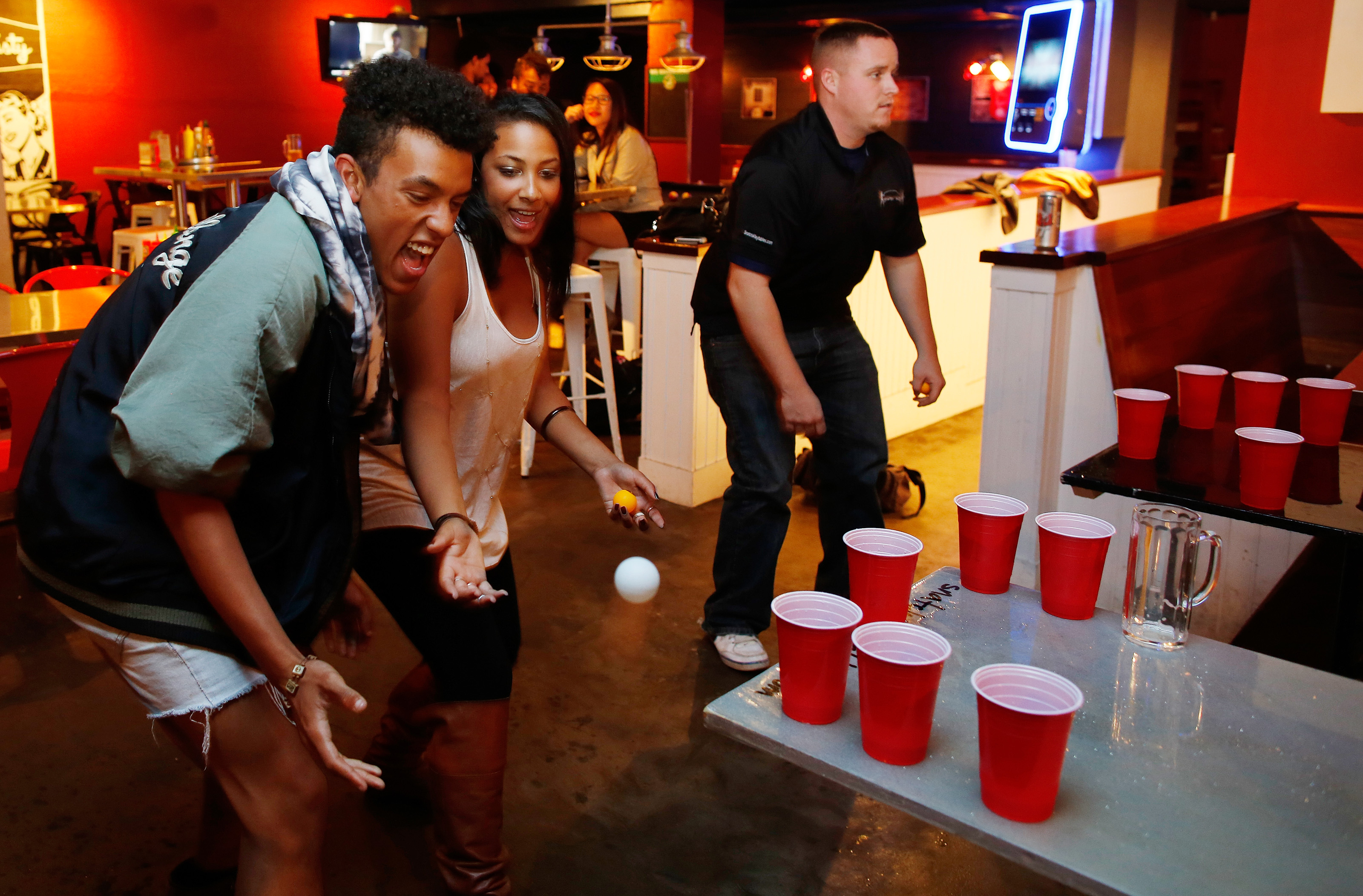 Nanshon Rosenfeld of Boston and Asia Schultz of Lexington, both 21, played “bar pong” at Tasty Burger. It stays open for hungry students and clubgoers until 4 a.m.