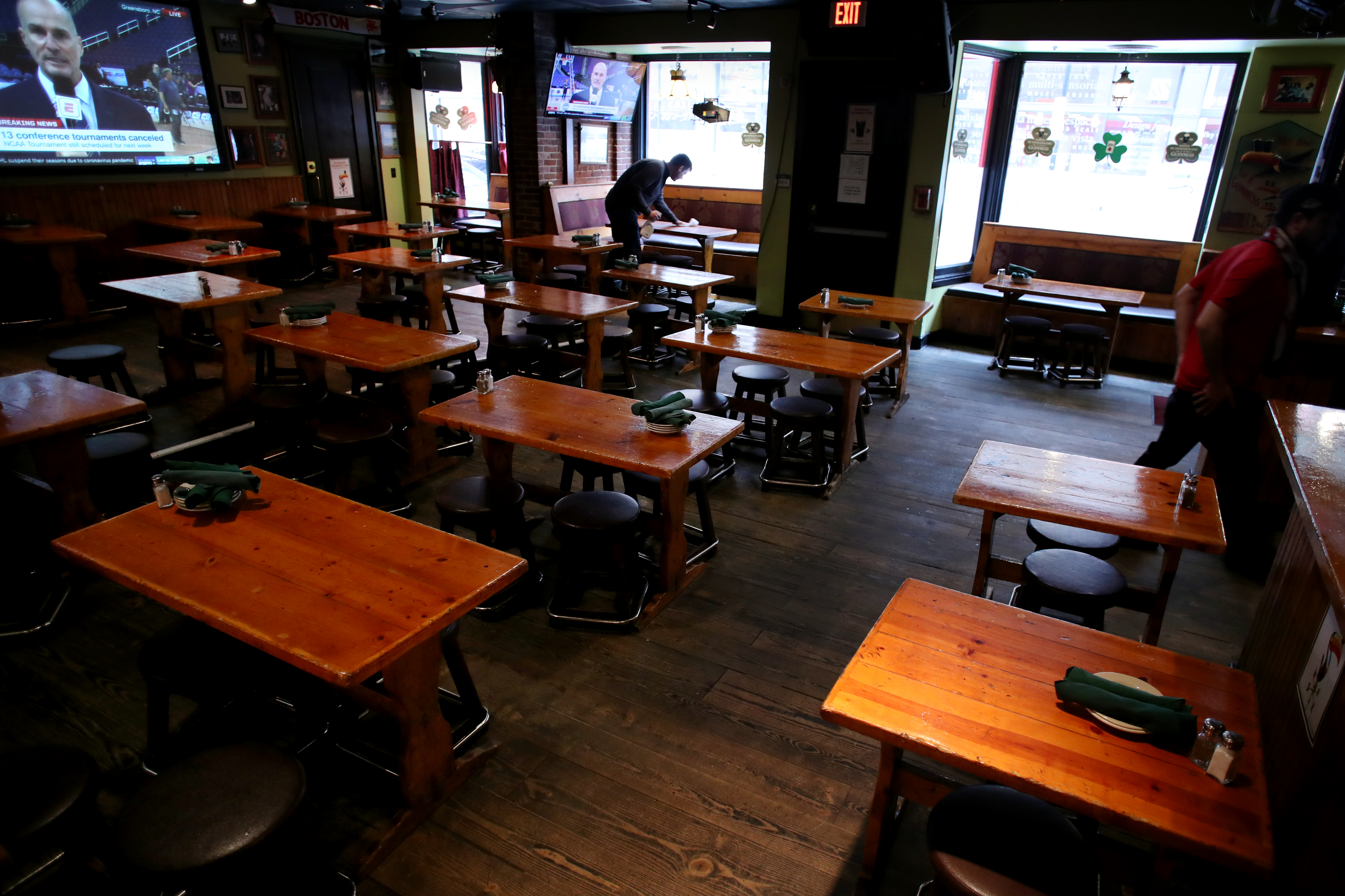 Manager Nick Mitchell cleaned a table at McGanns Irish Pub on Portland St. near TD Garden.