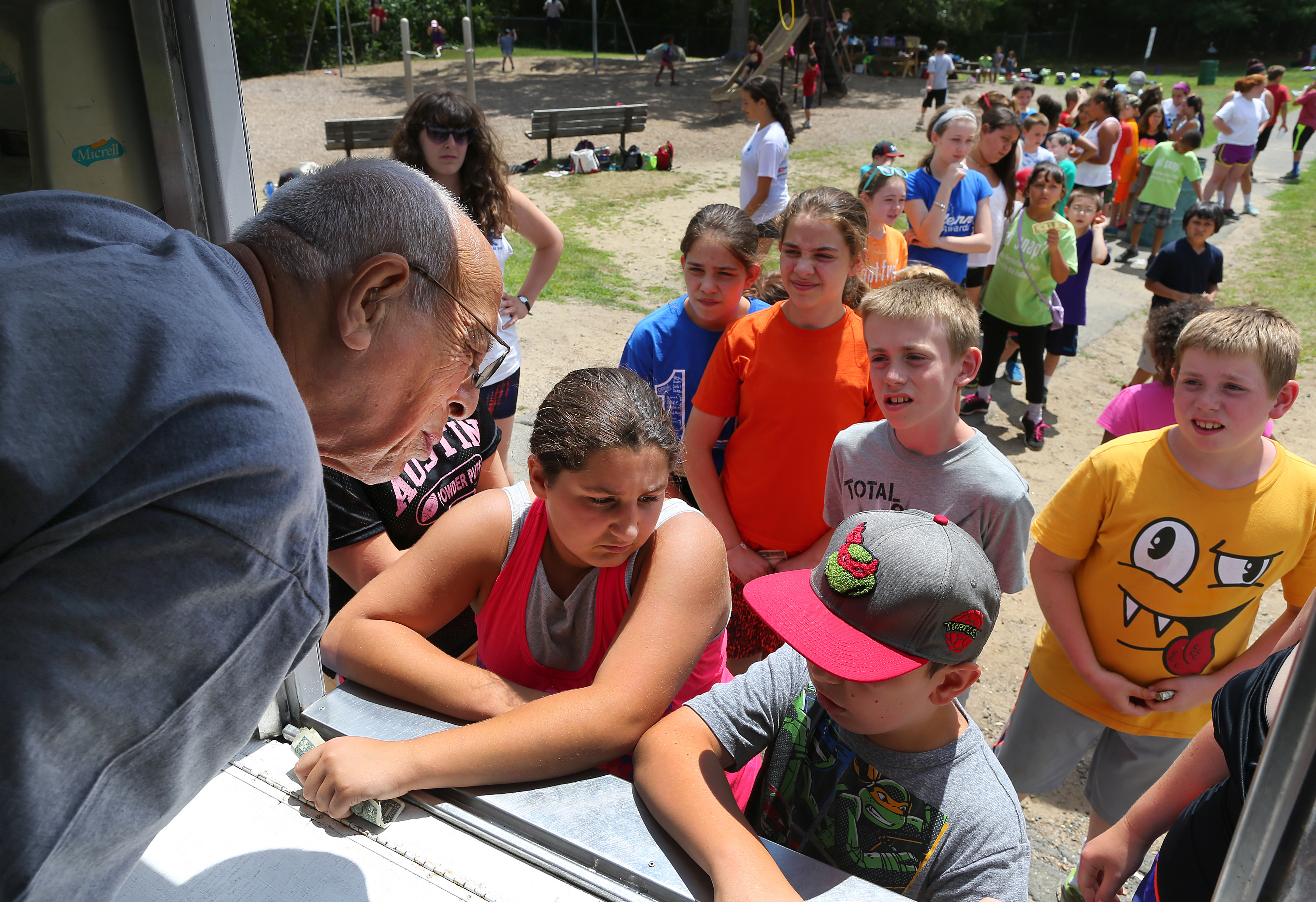 Allan Ganz, the Guinness record-holding ice cream man, visited neighborhoods in Peabody, serving ice cream to youths at West Memorial School.