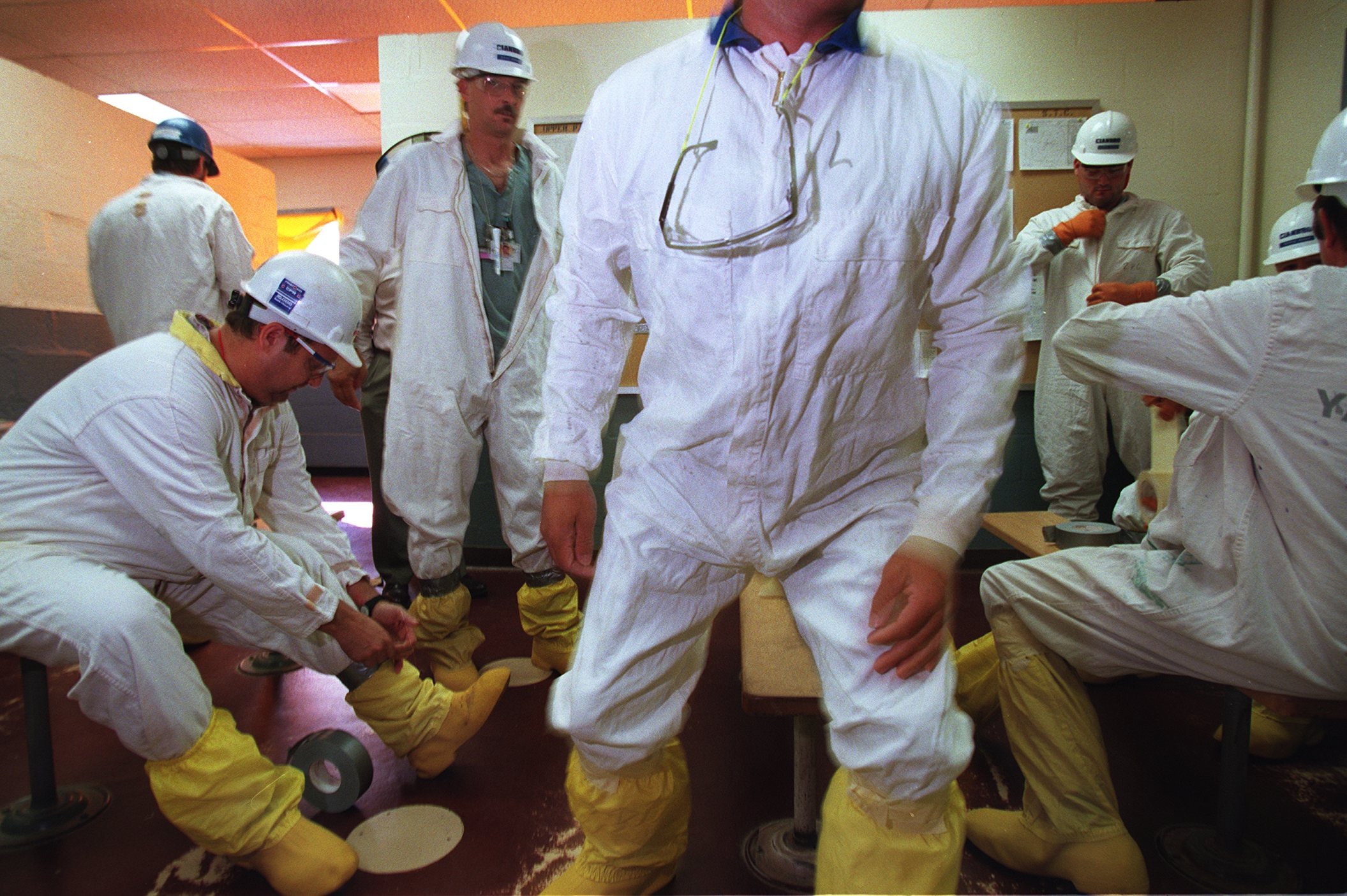 Workers at the Yankee Rowe Atomic plant donned protective clothing before entering the nuclear area as part of decommisioning work in 1996.