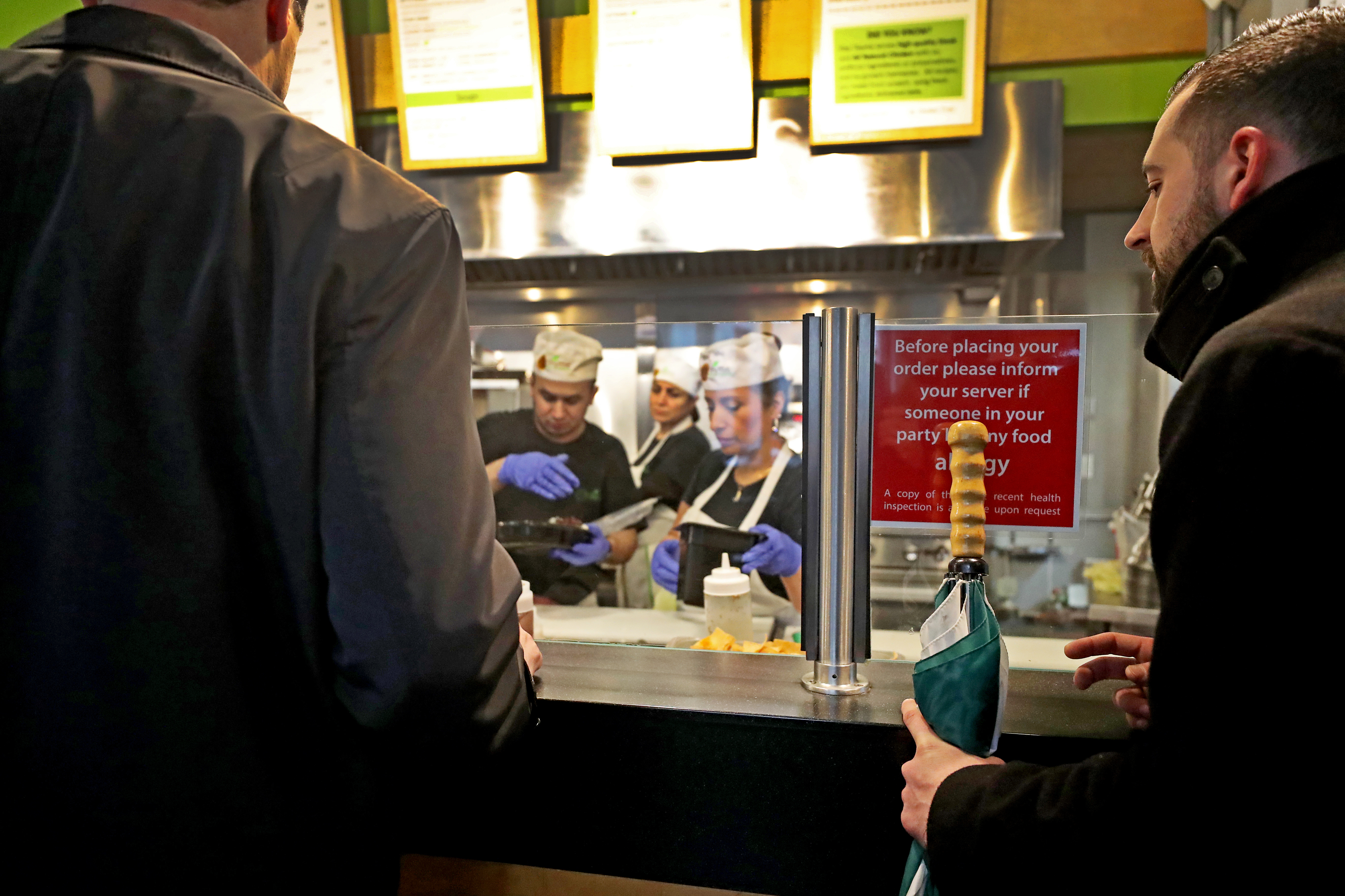 It's all about lunch at Pita Thyme downtown, which means dealing with long lines. Speed is crucial for everyone involved.