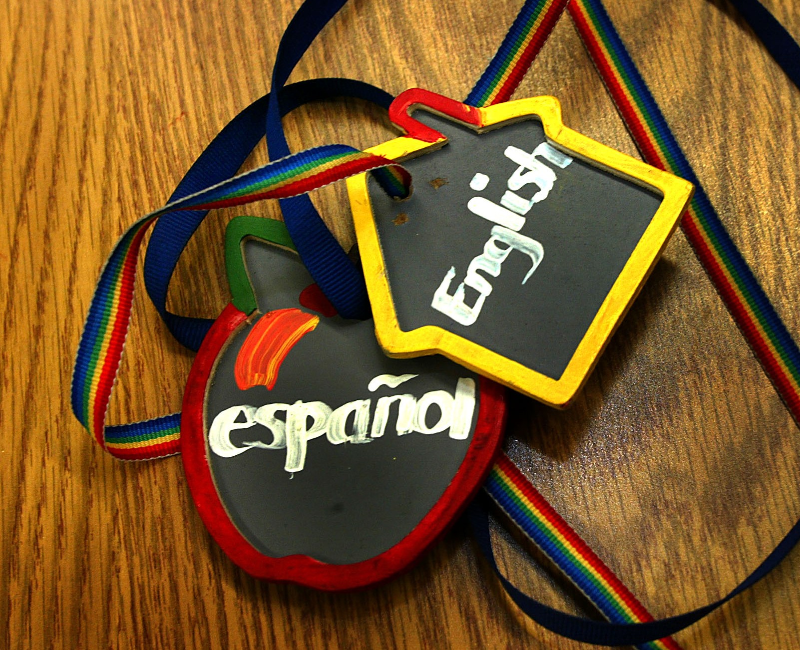 Teachers wore medalions at an elementary school in Framingham to let students know which language would be used in class.