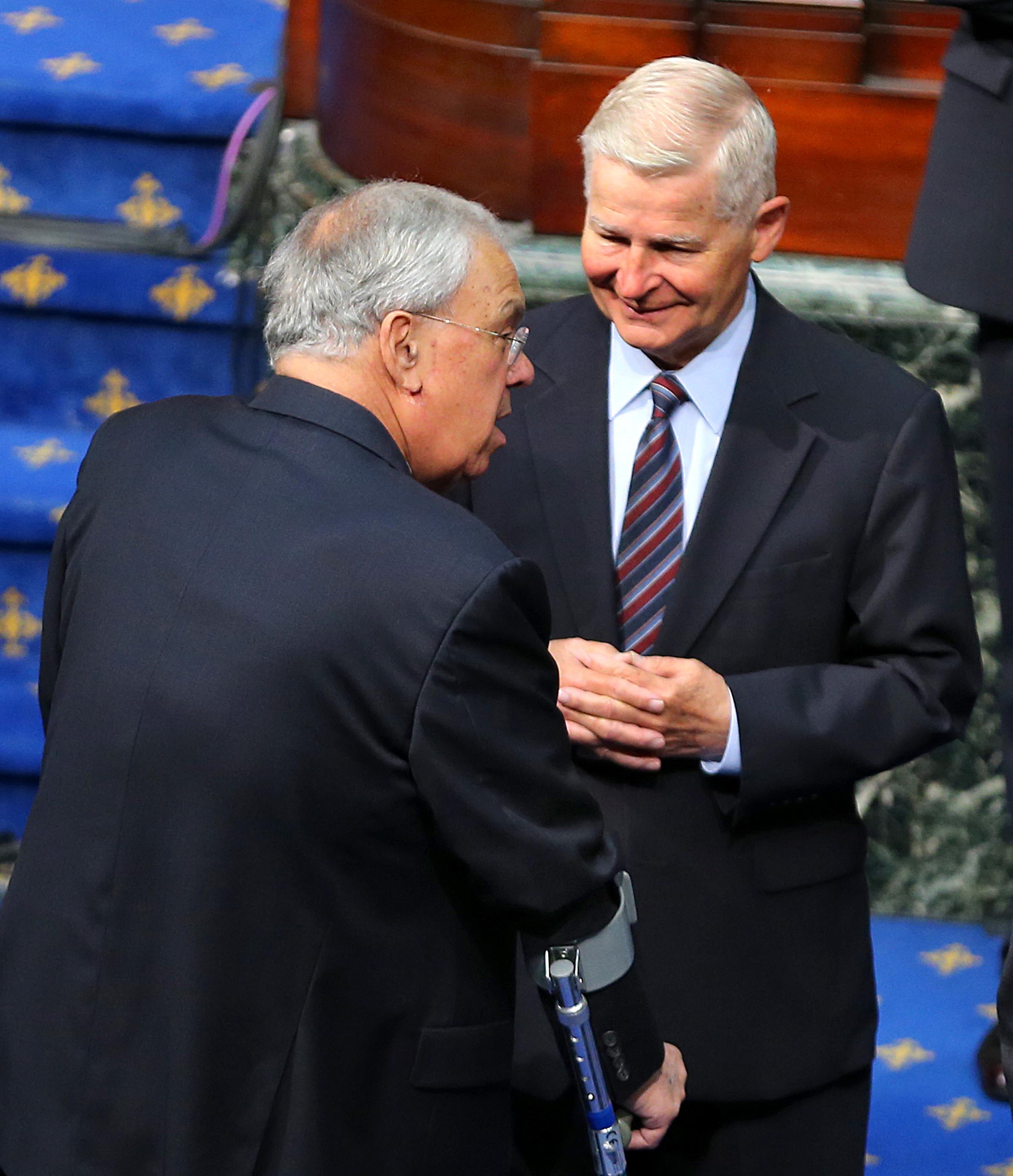 Mayor Thomas Menino talked with William Bulger during a service for former Governor Paul Cellucci on June 13.