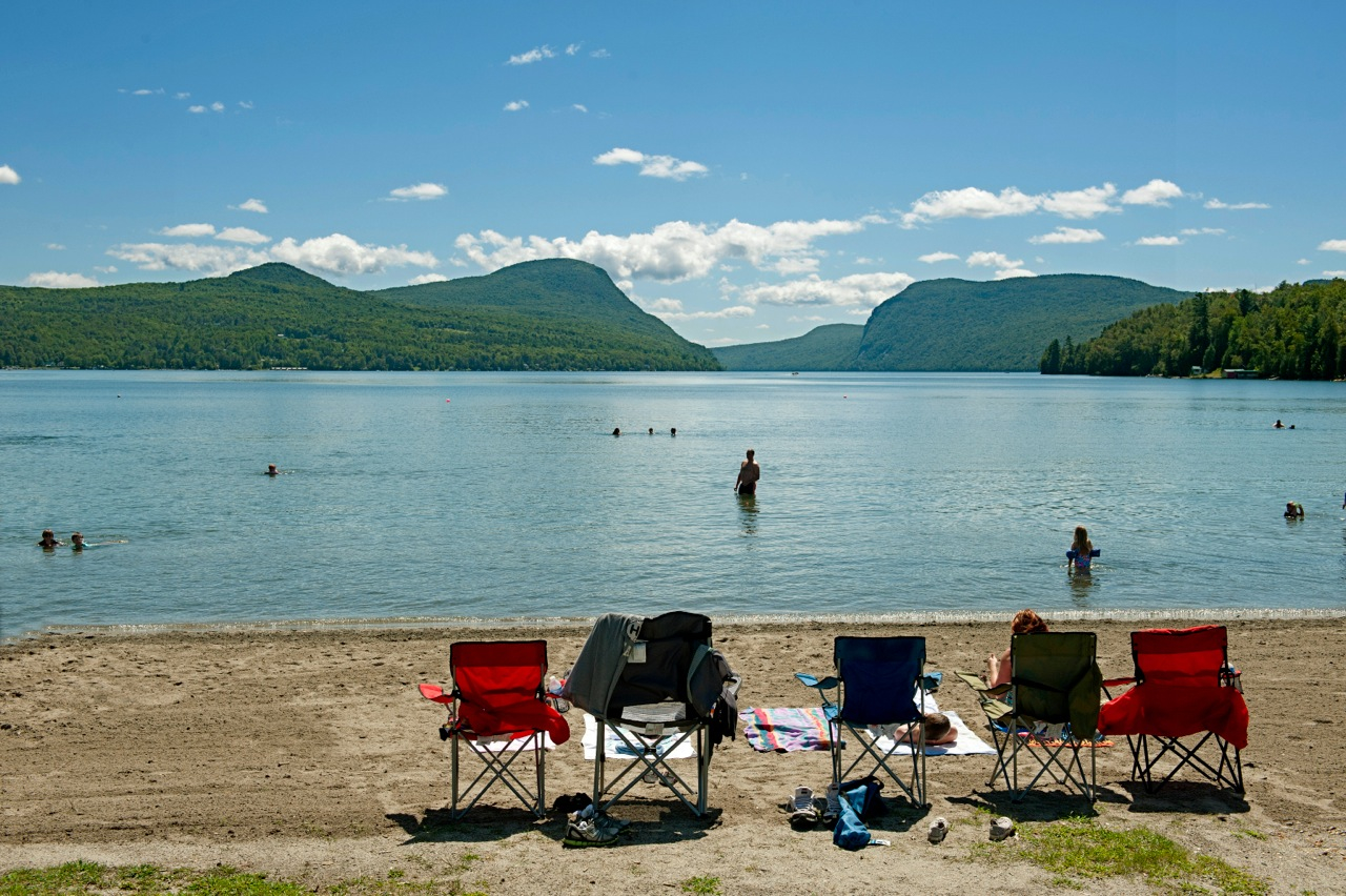 Deep-blue Lake Willoughby, reaching depths of 320 feet, is bordered by two sandy beaches.