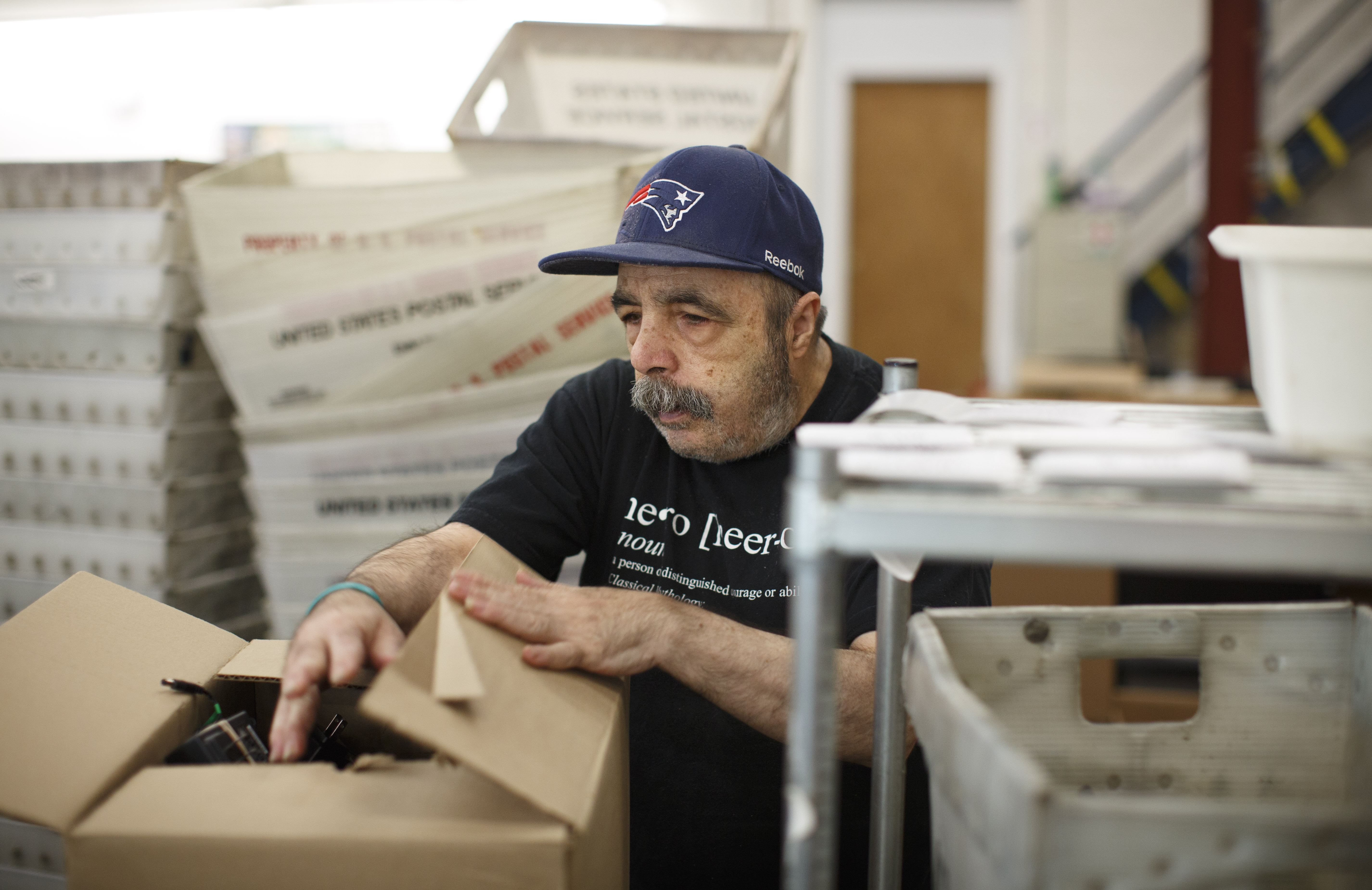 Darryl Vito sorted and packaged electronic cables during his shift at Triangle Inc. in Malden, as he worked on one of the workshop’s final contracts.