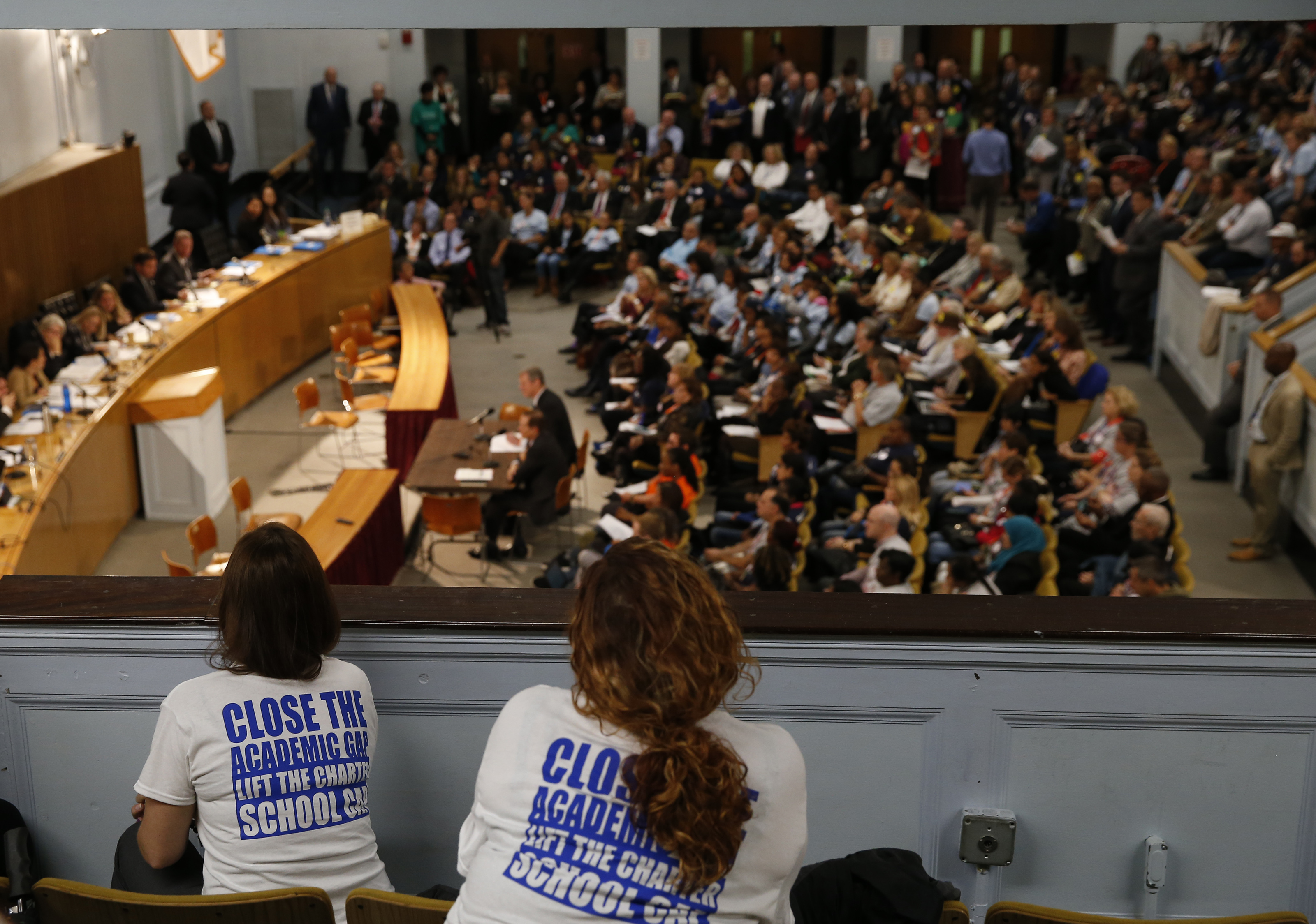 Charter school supporters leaned over a balcony and watched as Governor Charlie Baker gave testimony at a State House hearing last year.